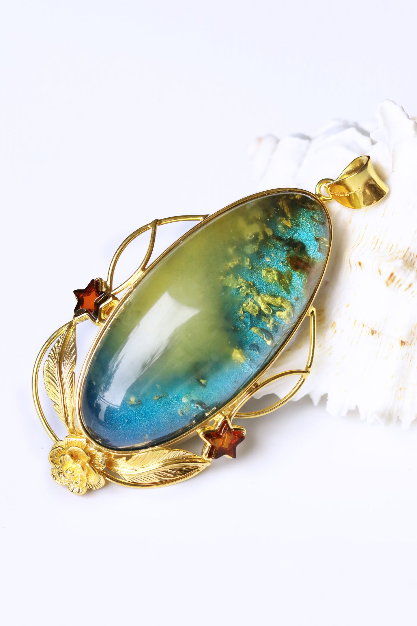 Large Unique Blue Amber Pendant with Milk Cloudy Inclusion and Cognac Stars in Gold Plated Silver