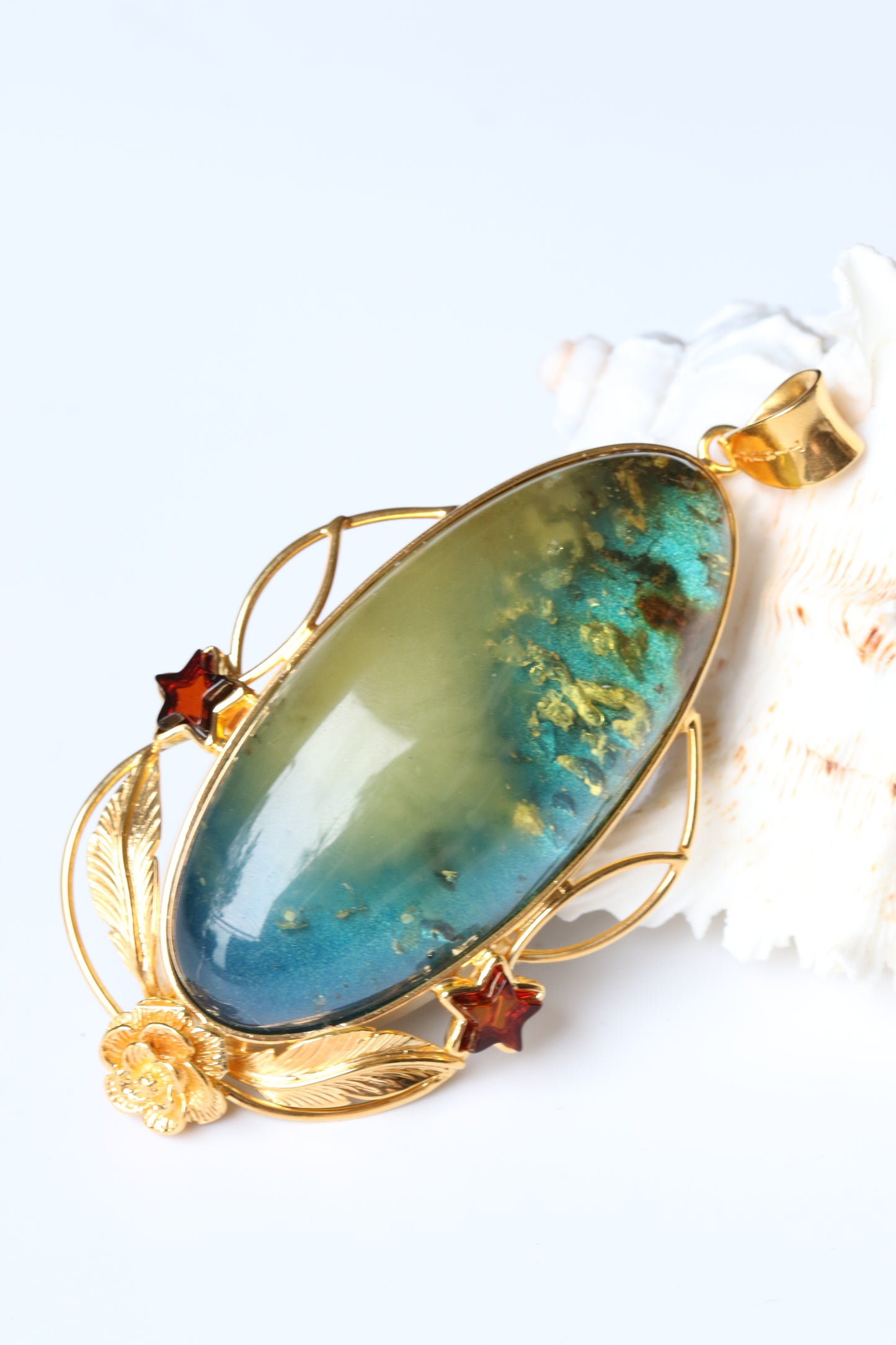 Large Unique Blue Amber Pendant with Milk Cloudy Inclusion and Cognac Stars in Gold Plated Silver