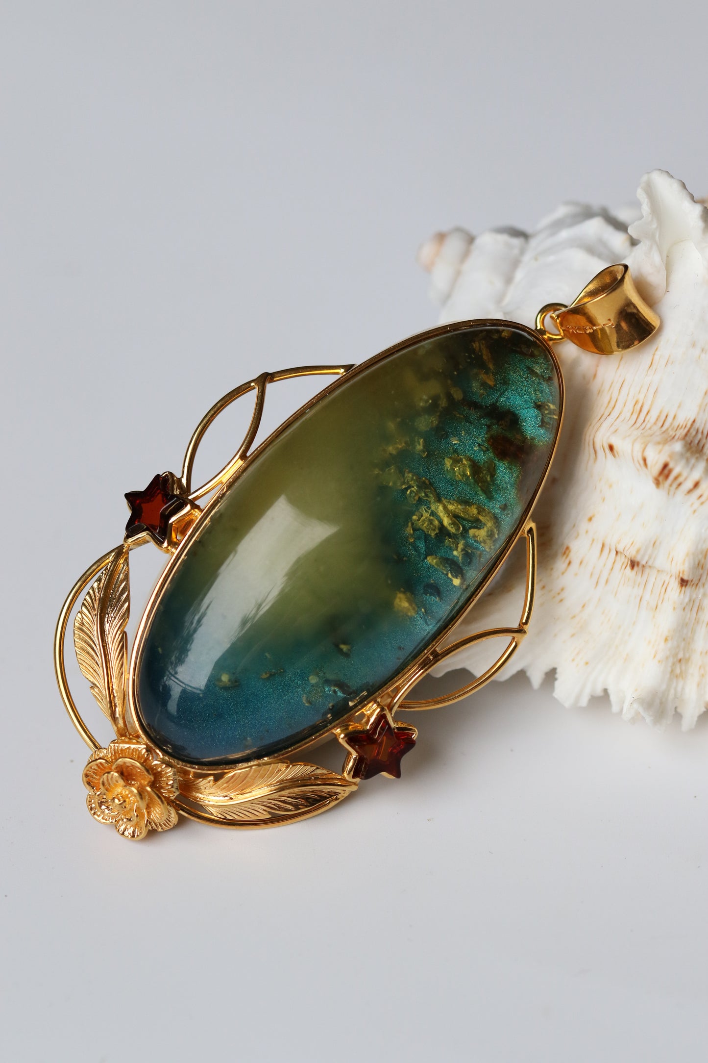 Large Unique Blue Amber Pendant with Milk Cloudy Inclusion and Cognac Stars in Gold Plated Silver