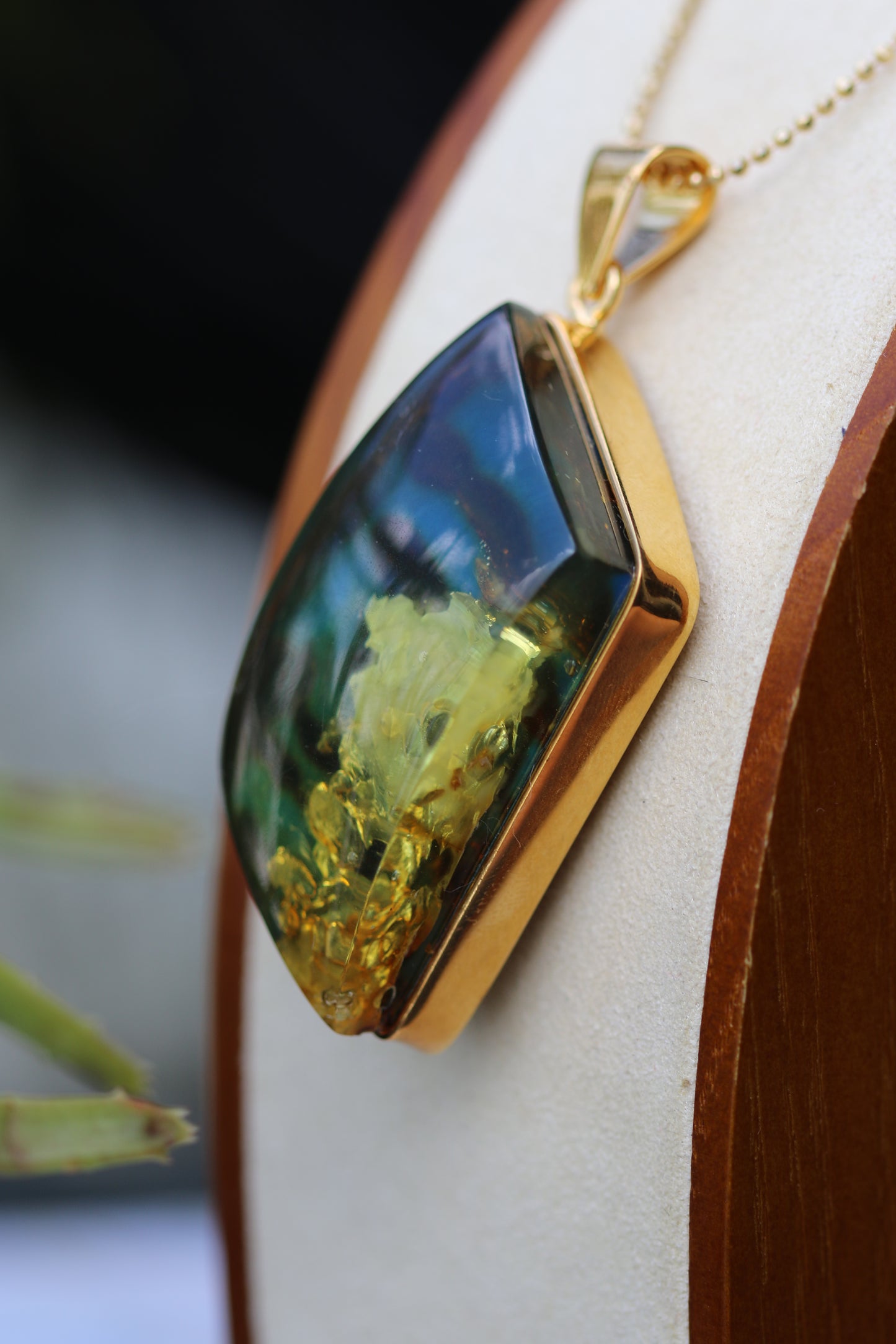Unique Rhombus Shaped Blue Amber Pendant with Natural Inclusions in Gold Plated Silver