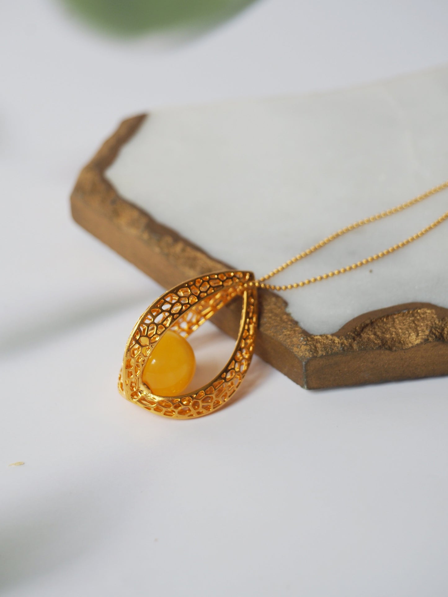 Chic Caged Triangle Pendant with a Butterscotch Amber Orb