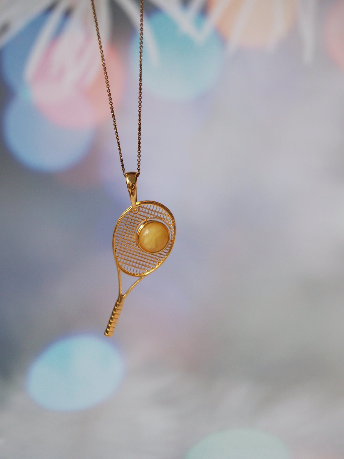 Tennis Racket Pendant with Rotating Double Color Amber