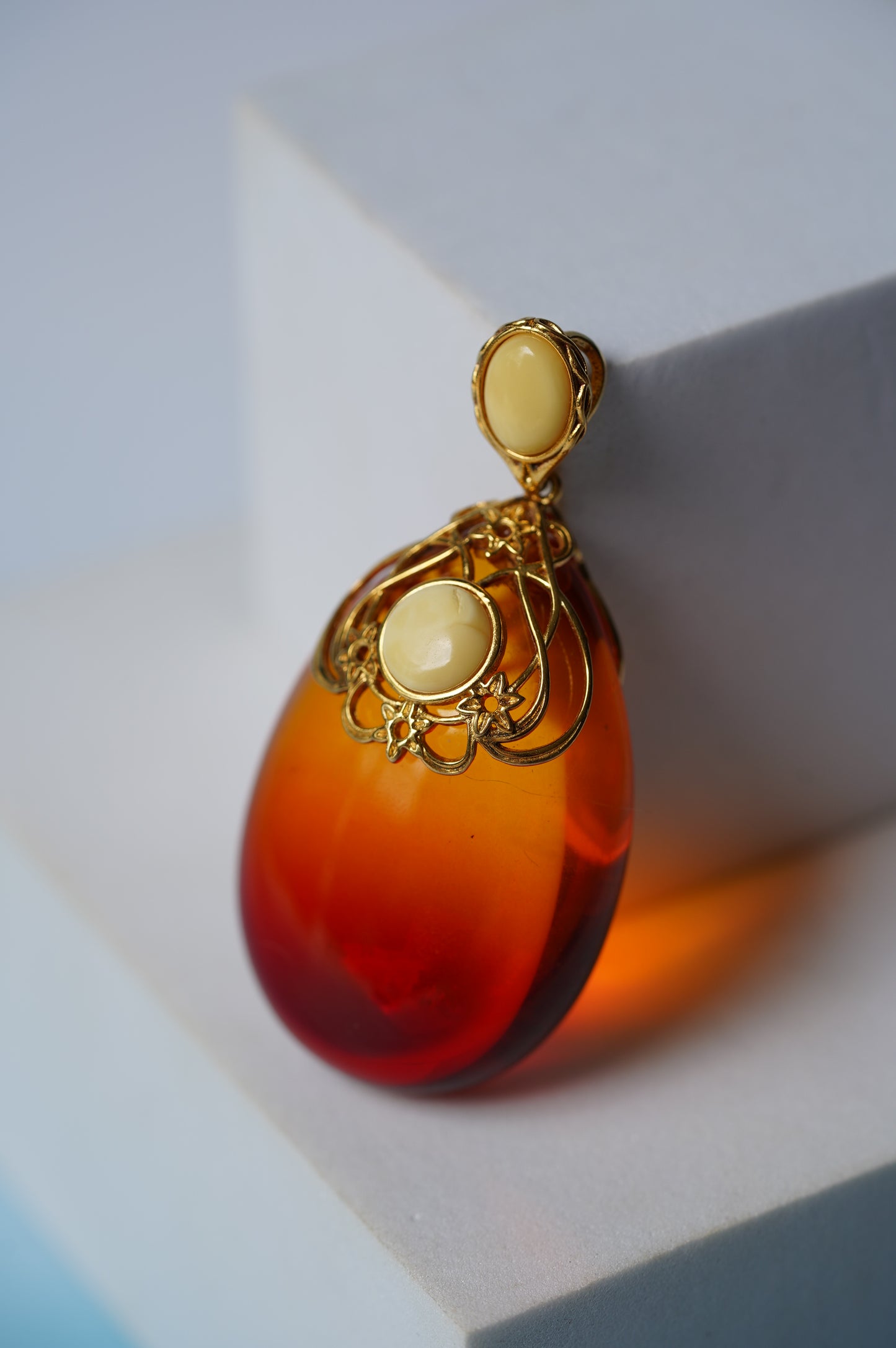Gradient/ Ombre Red Amber Pendant with Gold Plated Silver and Milk Amber Frame