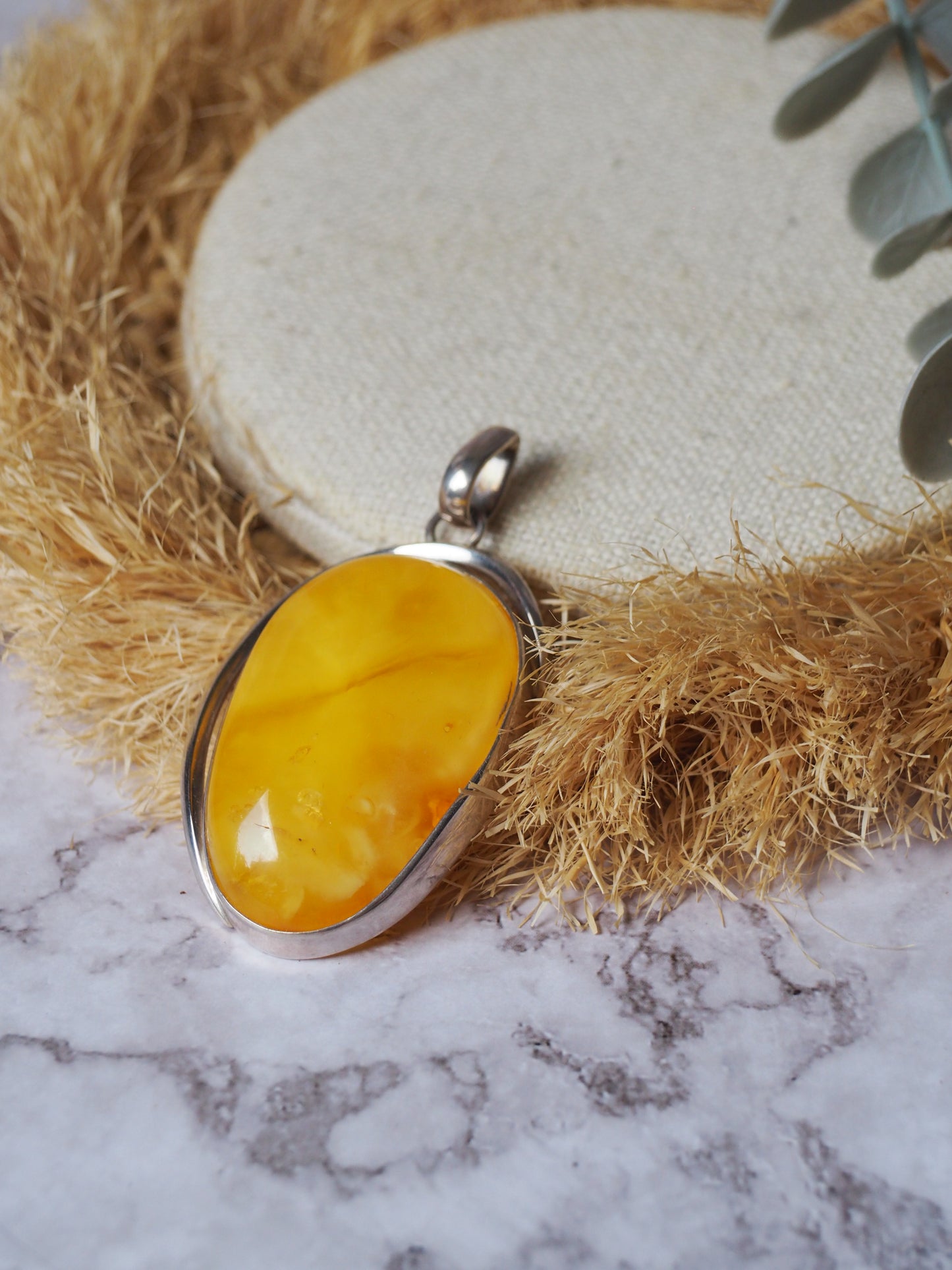 Natural butterscotch Amber Pendant with Raw Back in Silver Frame