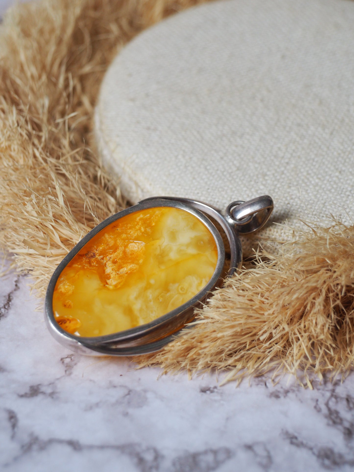 Natural butterscotch Amber Pendant with Raw Back in Silver Frame