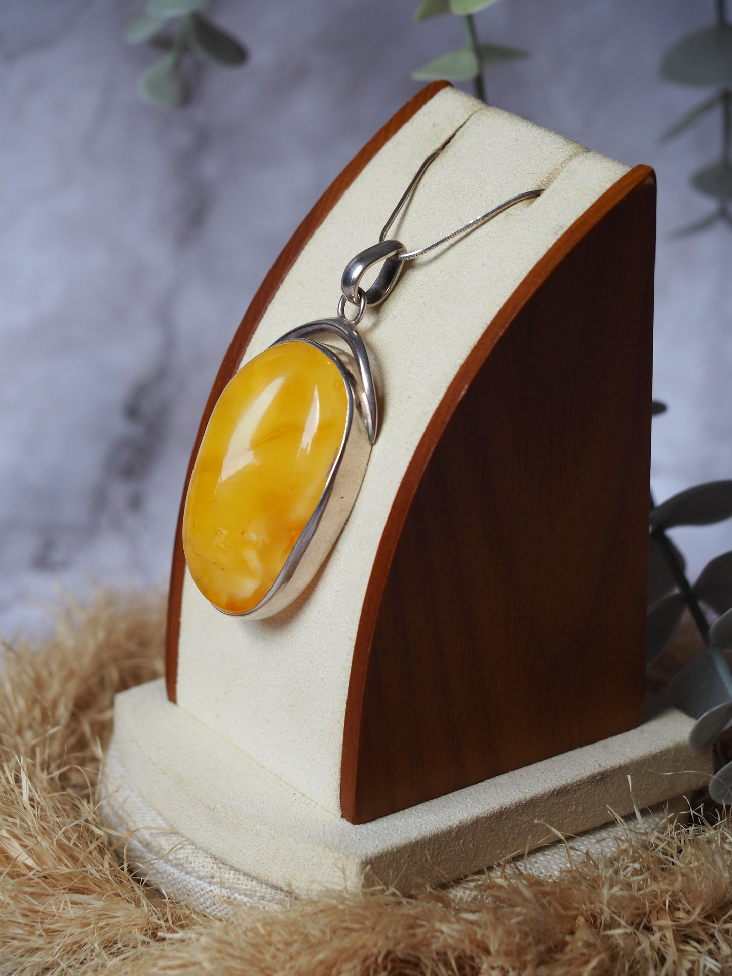 Natural butterscotch Amber Pendant with Raw Back in Silver Frame