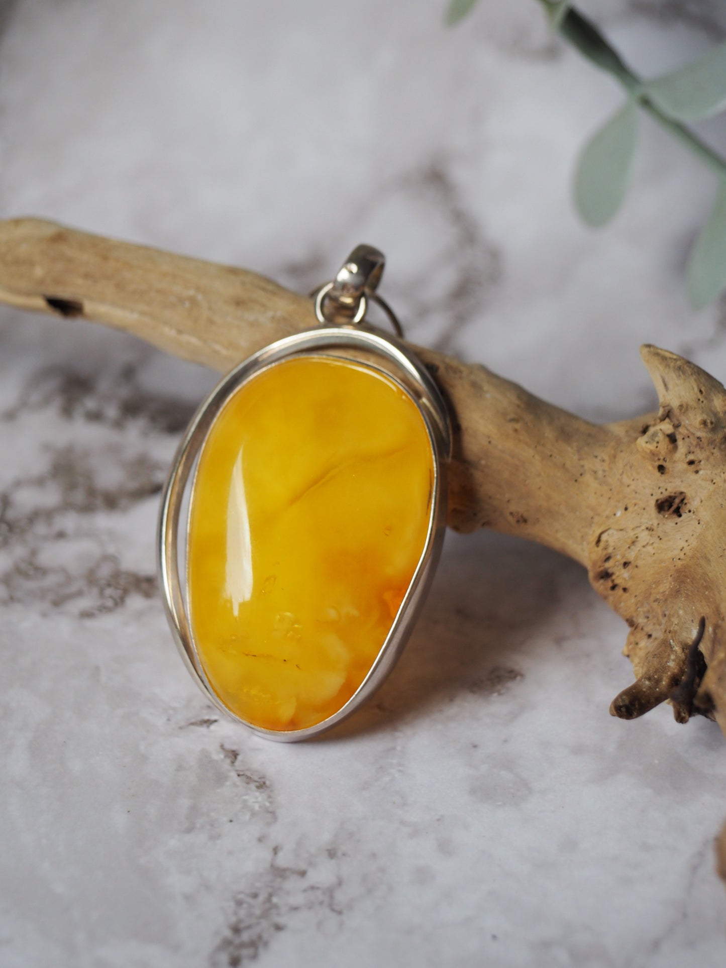 Natural butterscotch Amber Pendant with Raw Back in Silver Frame