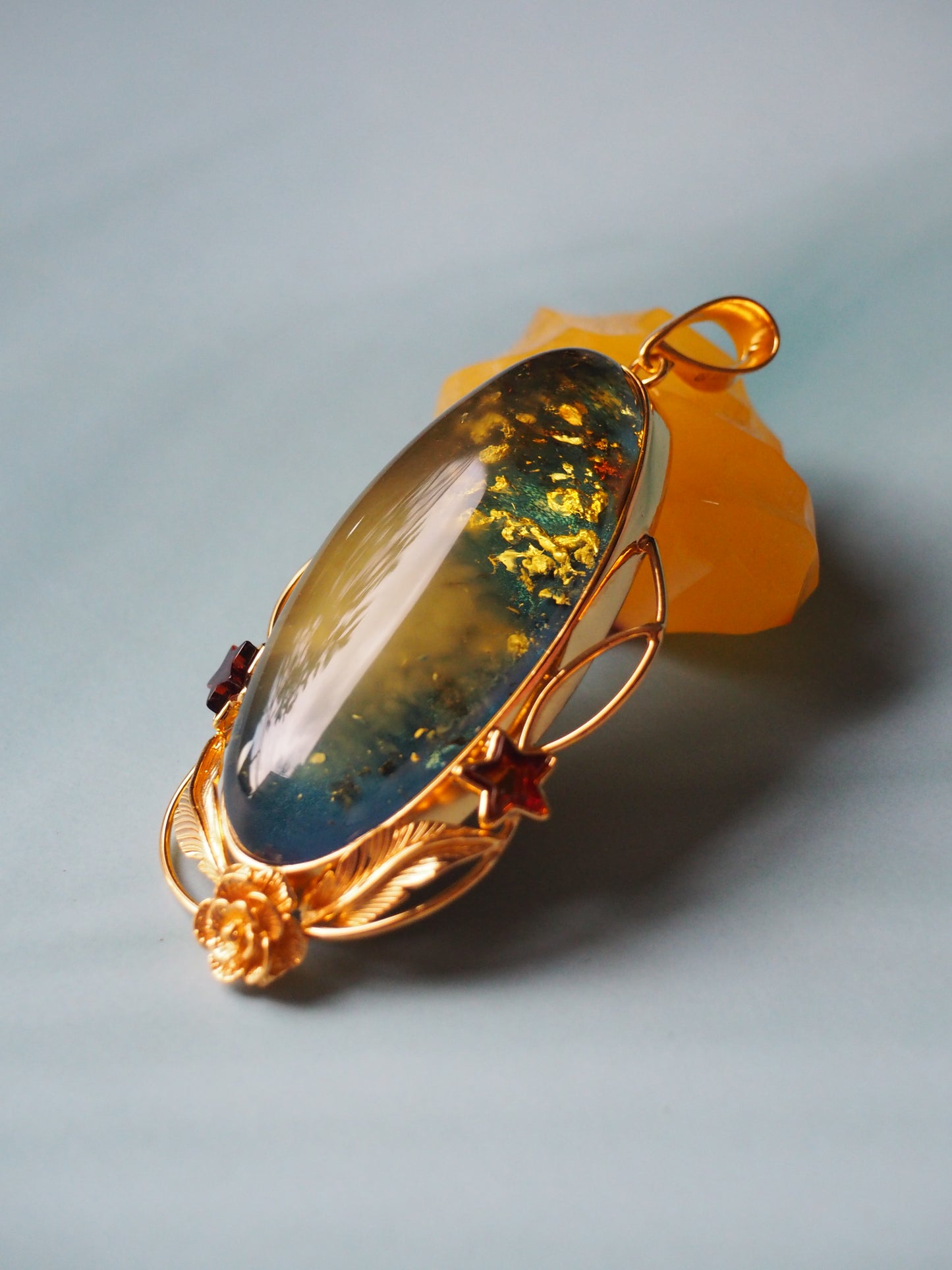 Large Unique Blue Amber Pendant with Milk Cloudy Inclusion and Cognac Stars in Gold Plated Silver