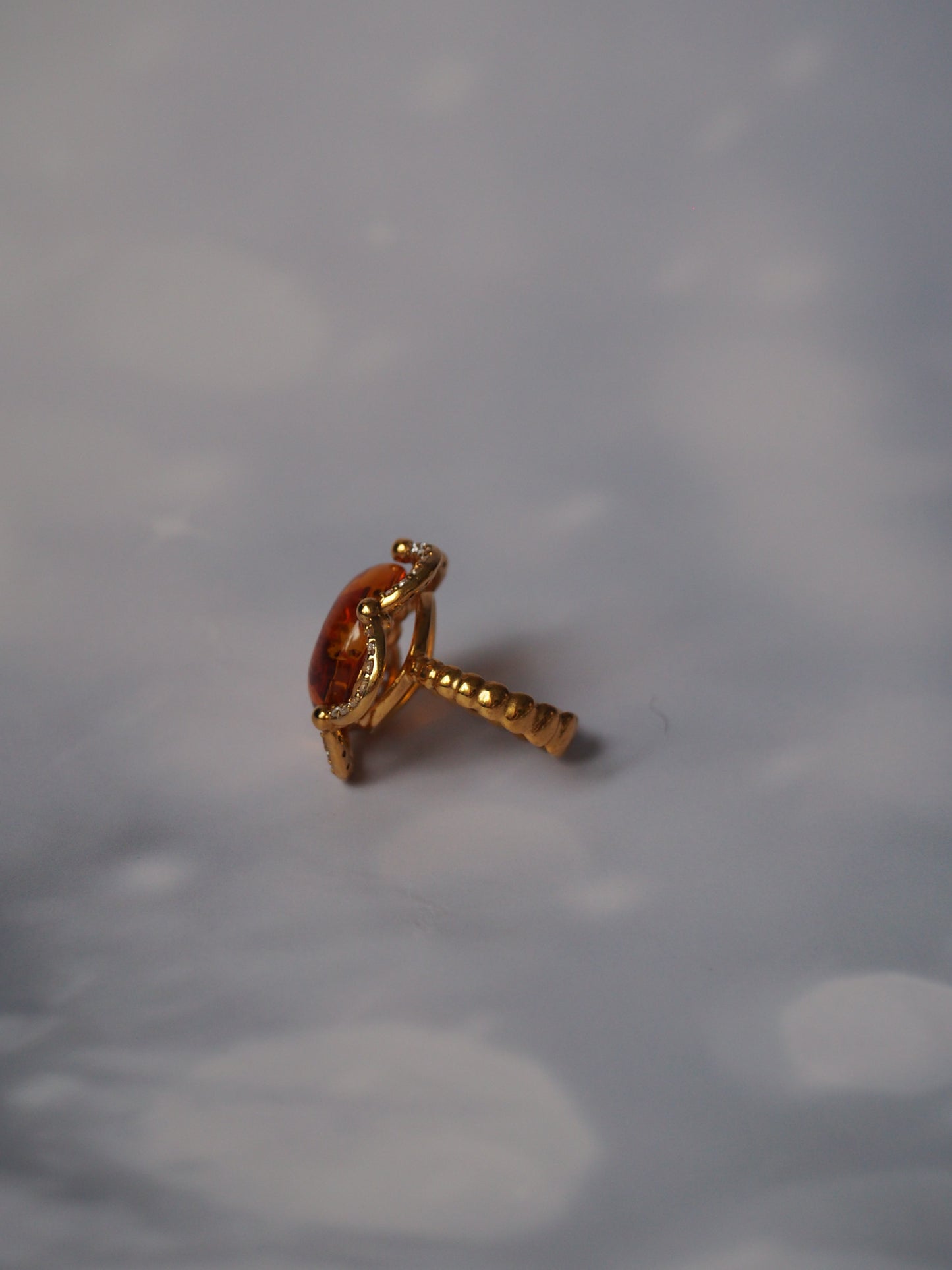 Delicate Flower Shaped Cognac Amber Ring with Cubic Zirconia in Gold Plated Silver