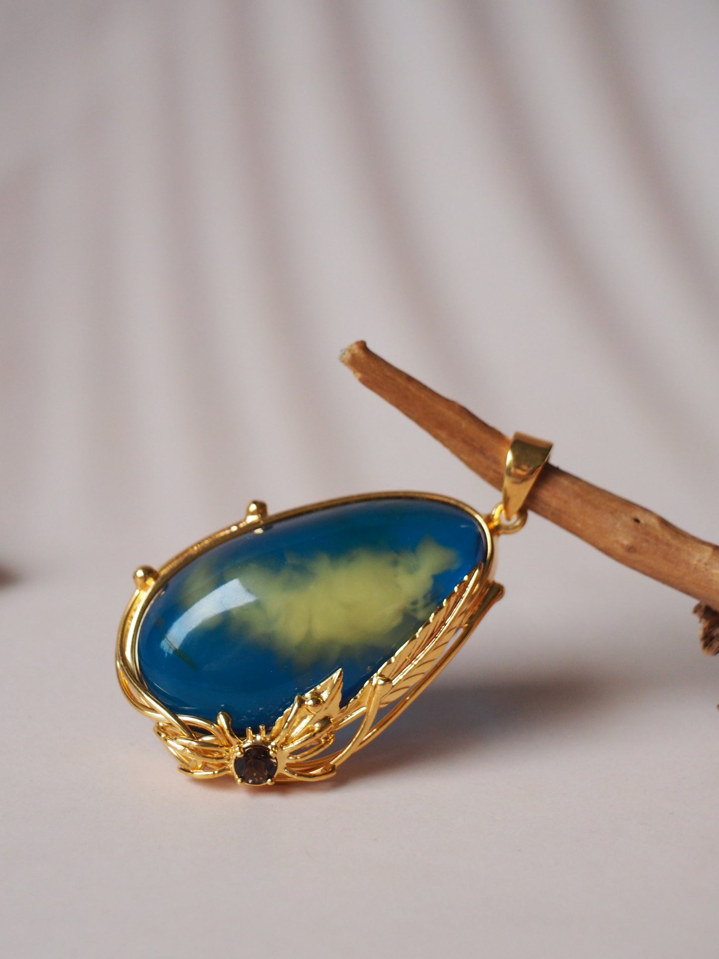 Unique Blue Amber Pendant with Milk Inclusion and Amethyst in Gold Plated Silver