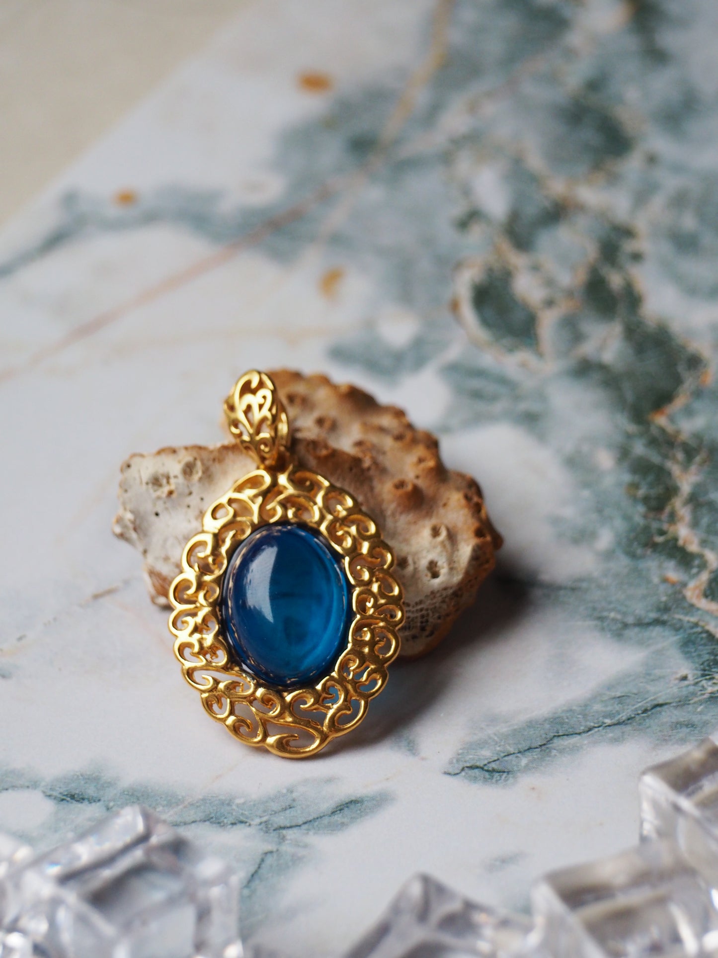 Elegant Blue Amber Oval Pendant in Golden Embroidery