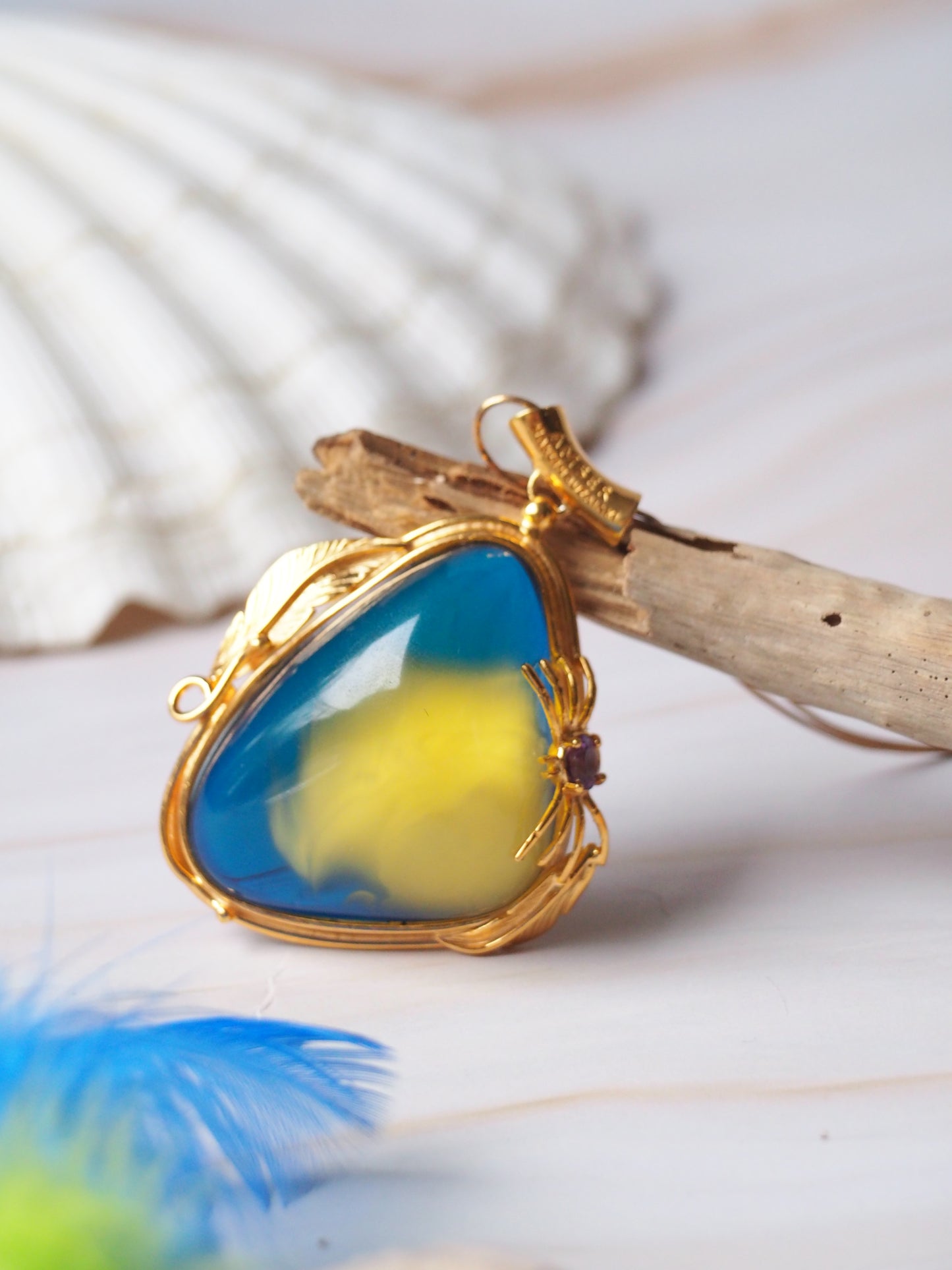Unique Blue Amber Pendant with Milk Inclusion in Gold Plated Silver