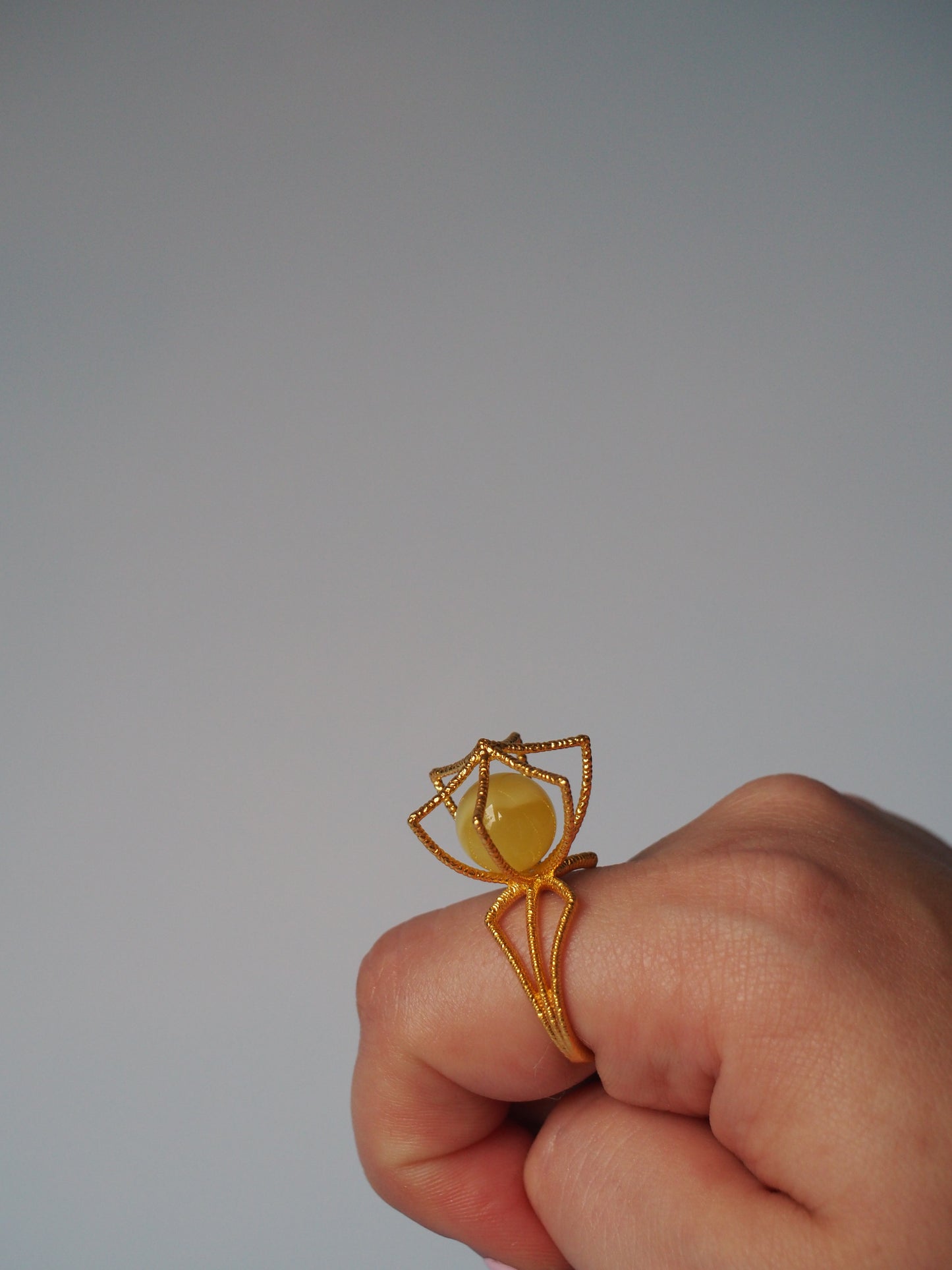 Geometric Cage Ring With Butterscotch Amber And Gold Plated Silver