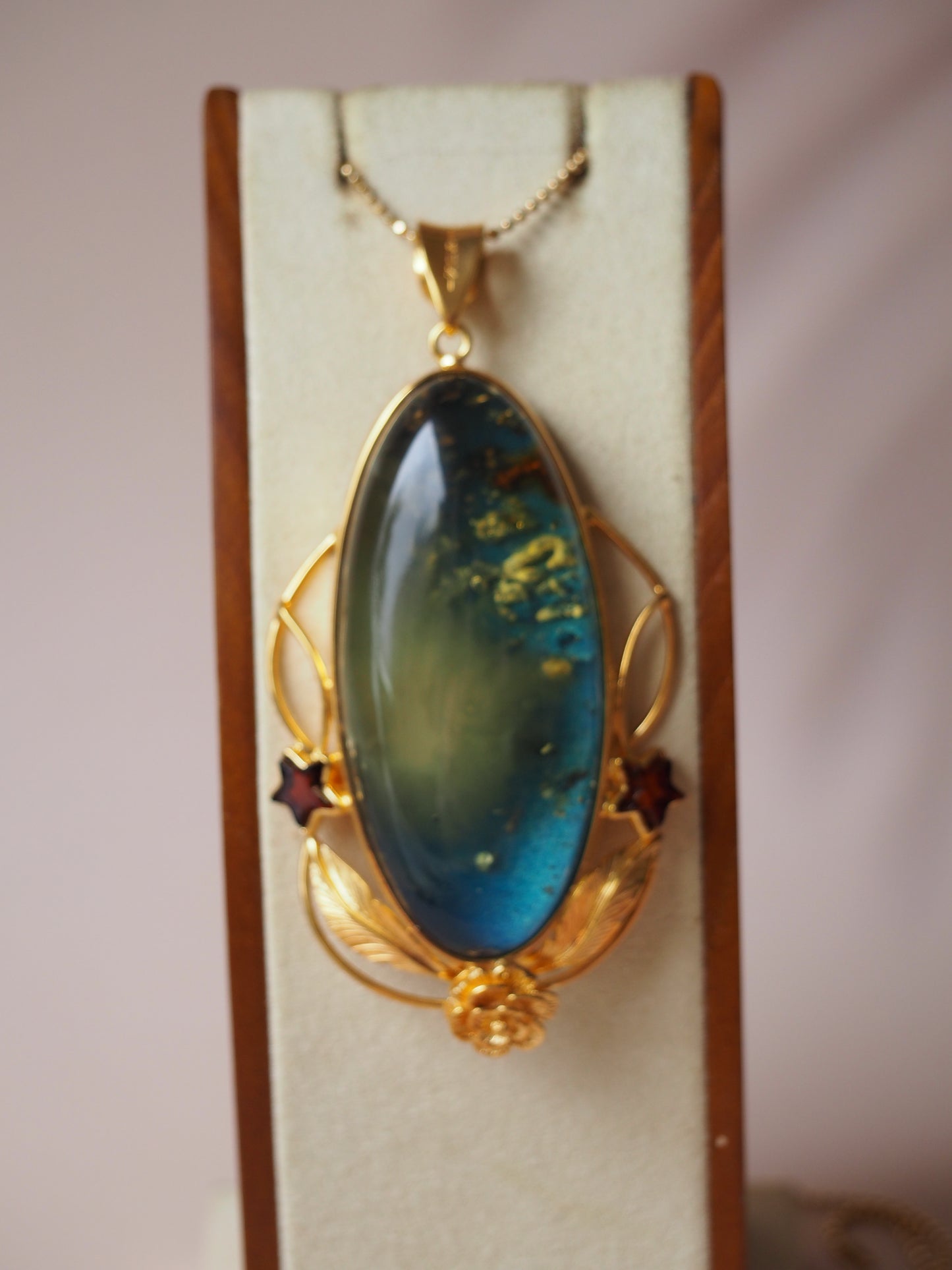 Large Unique Blue Amber Pendant with Milk Cloudy Inclusion and Cognac Stars in Gold Plated Silver