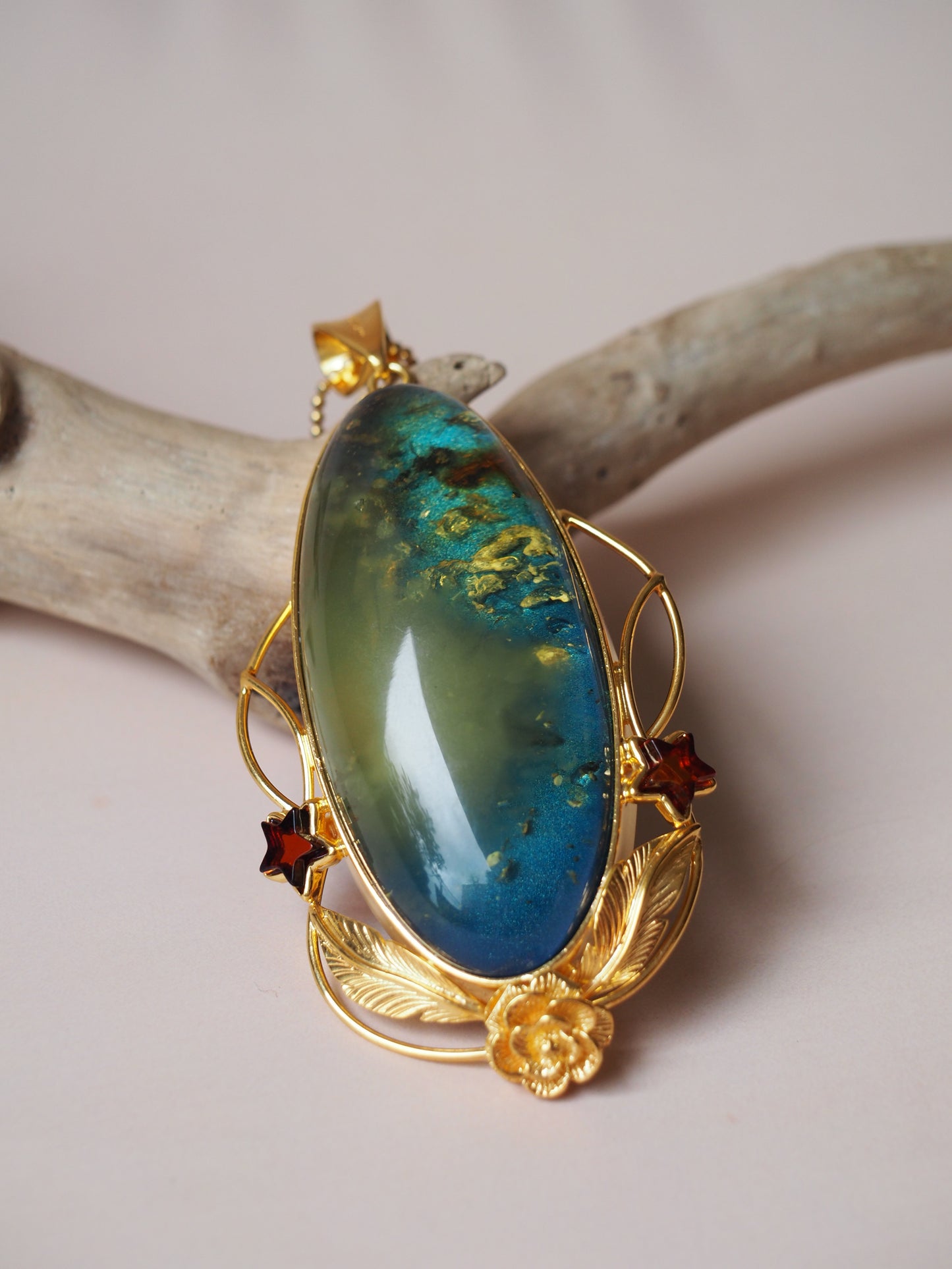Large Unique Blue Amber Pendant with Milk Cloudy Inclusion and Cognac Stars in Gold Plated Silver
