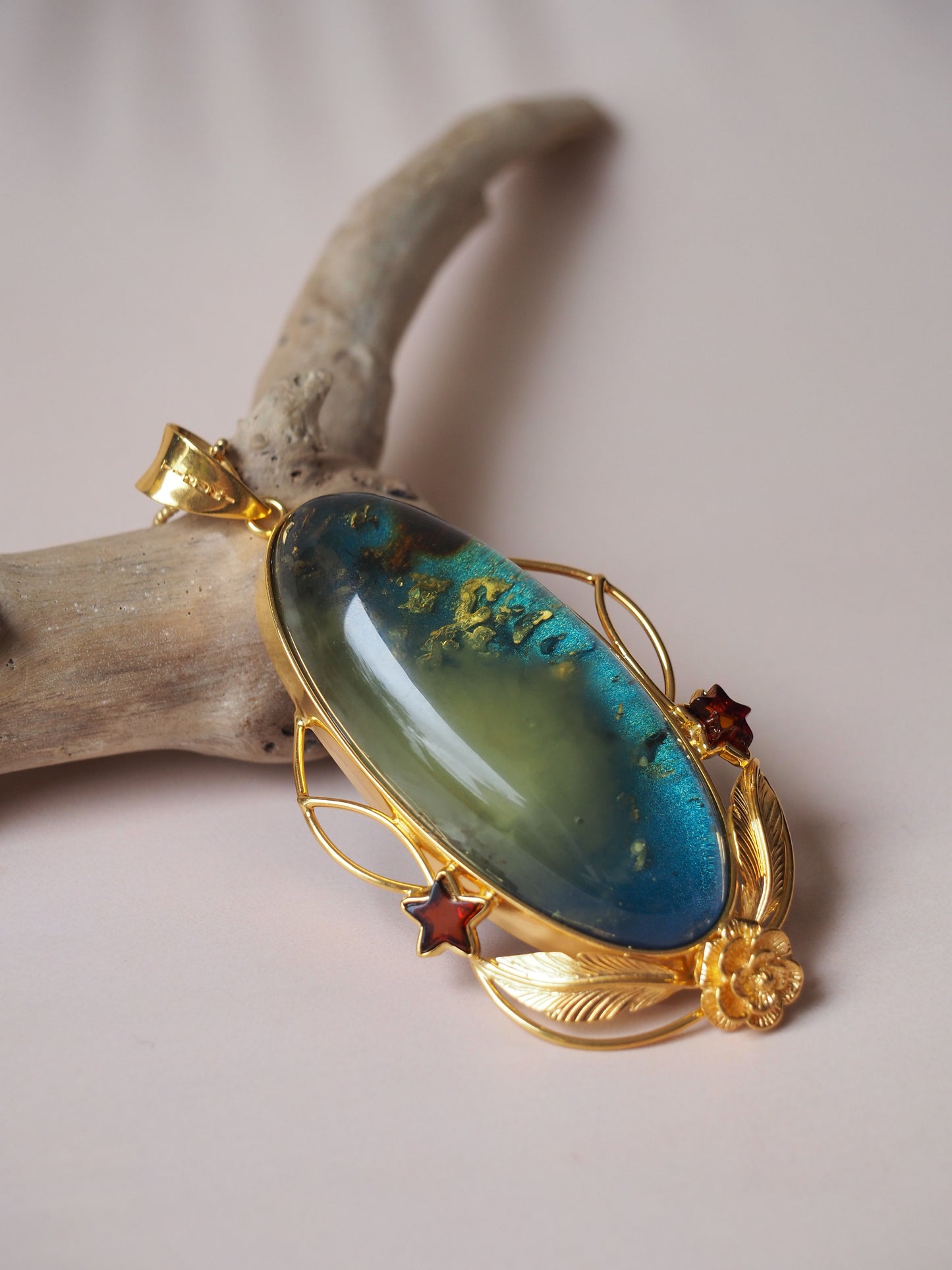 Large Unique Blue Amber Pendant with Milk Cloudy Inclusion and Cognac Stars in Gold Plated Silver