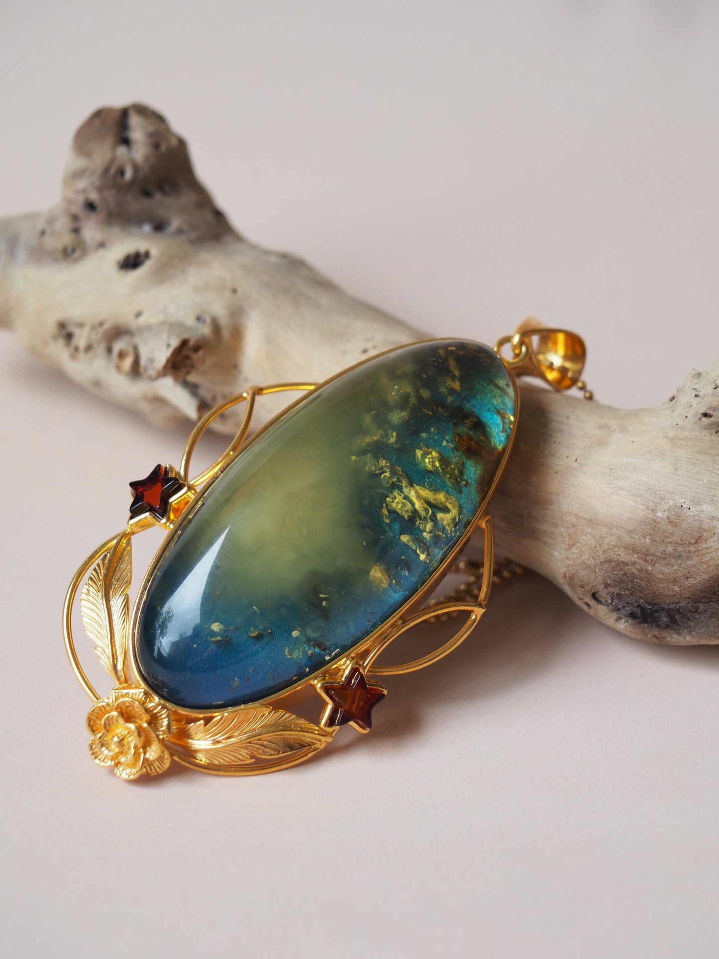 Large Unique Blue Amber Pendant with Milk Cloudy Inclusion and Cognac Stars in Gold Plated Silver