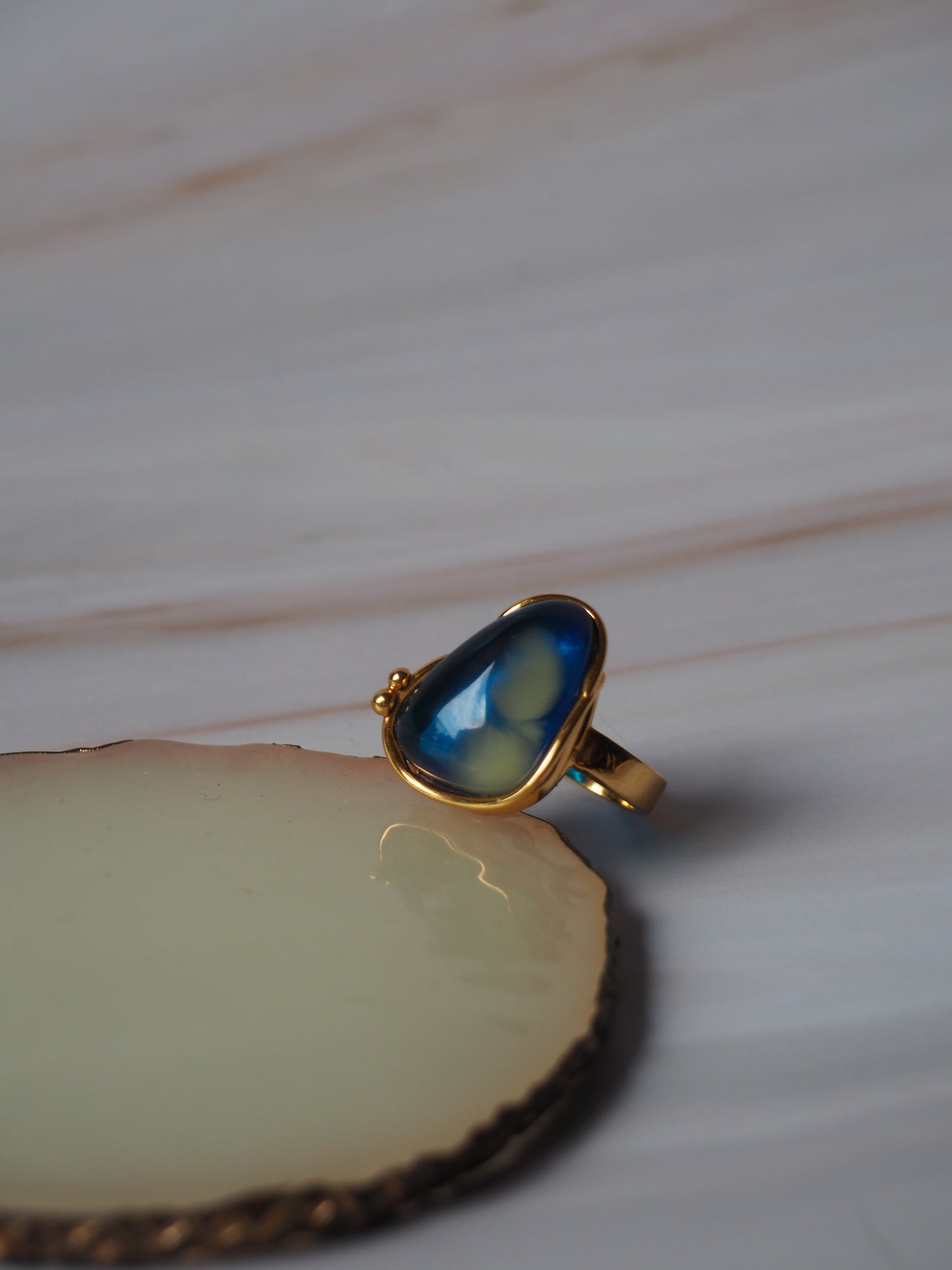 Unique Blue Amber Ring with Milk Inclusion in Gold Plated Silver