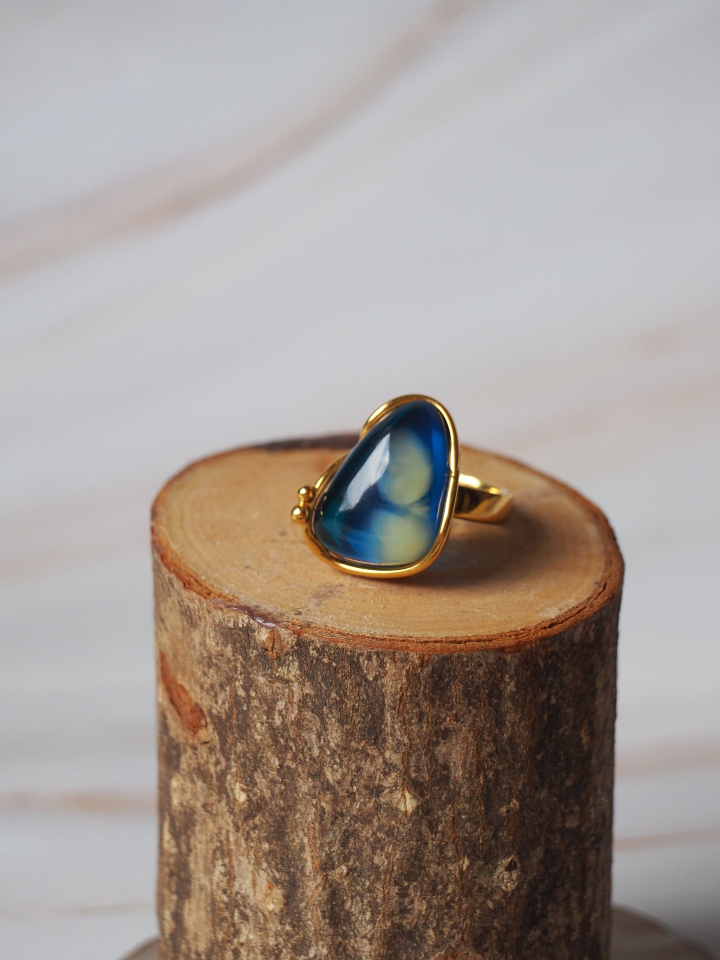 Unique Blue Amber Ring with Milk Inclusion in Gold Plated Silver