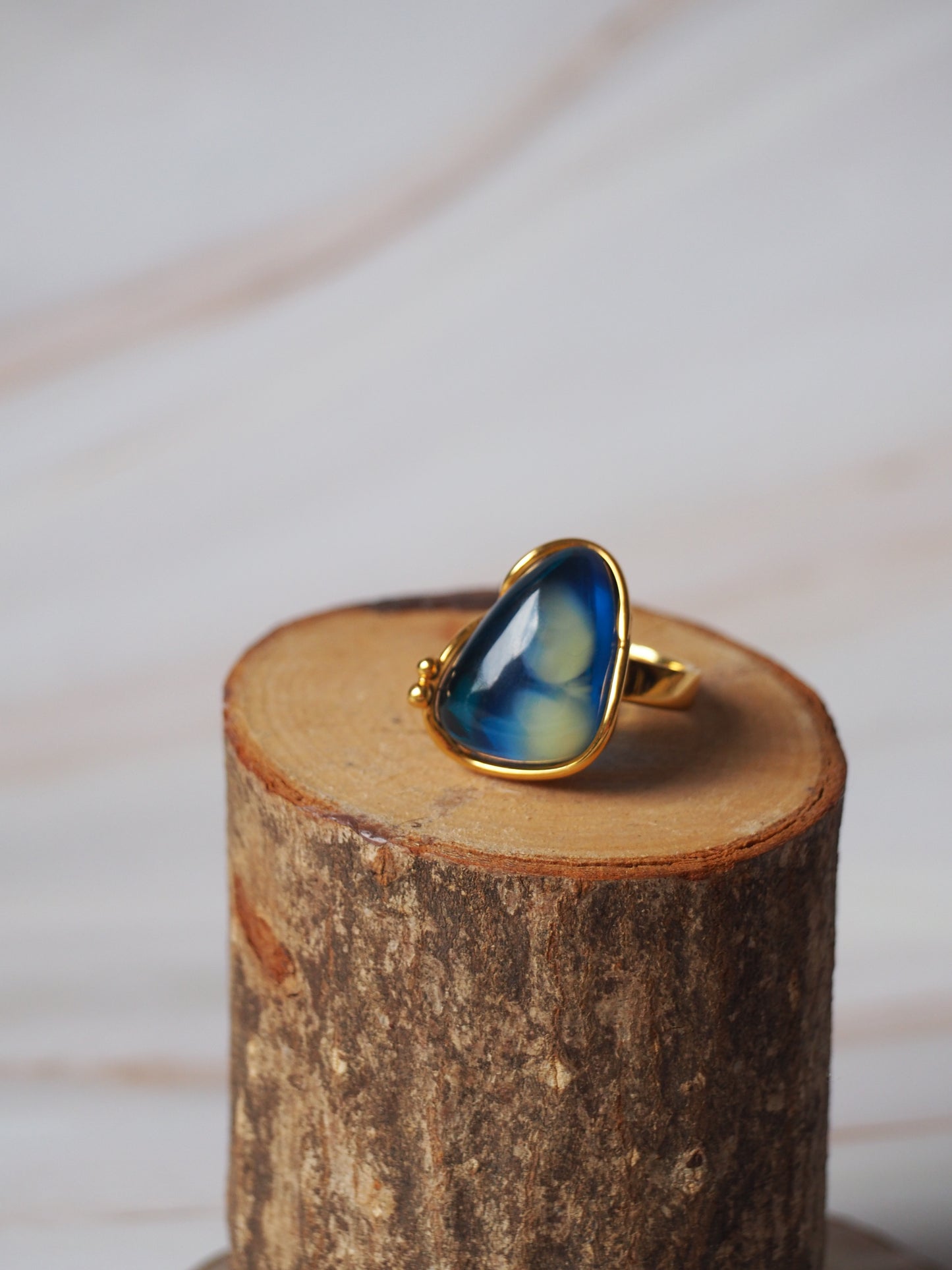 Unique Blue Amber Ring with Milk Inclusion in Gold Plated Silver