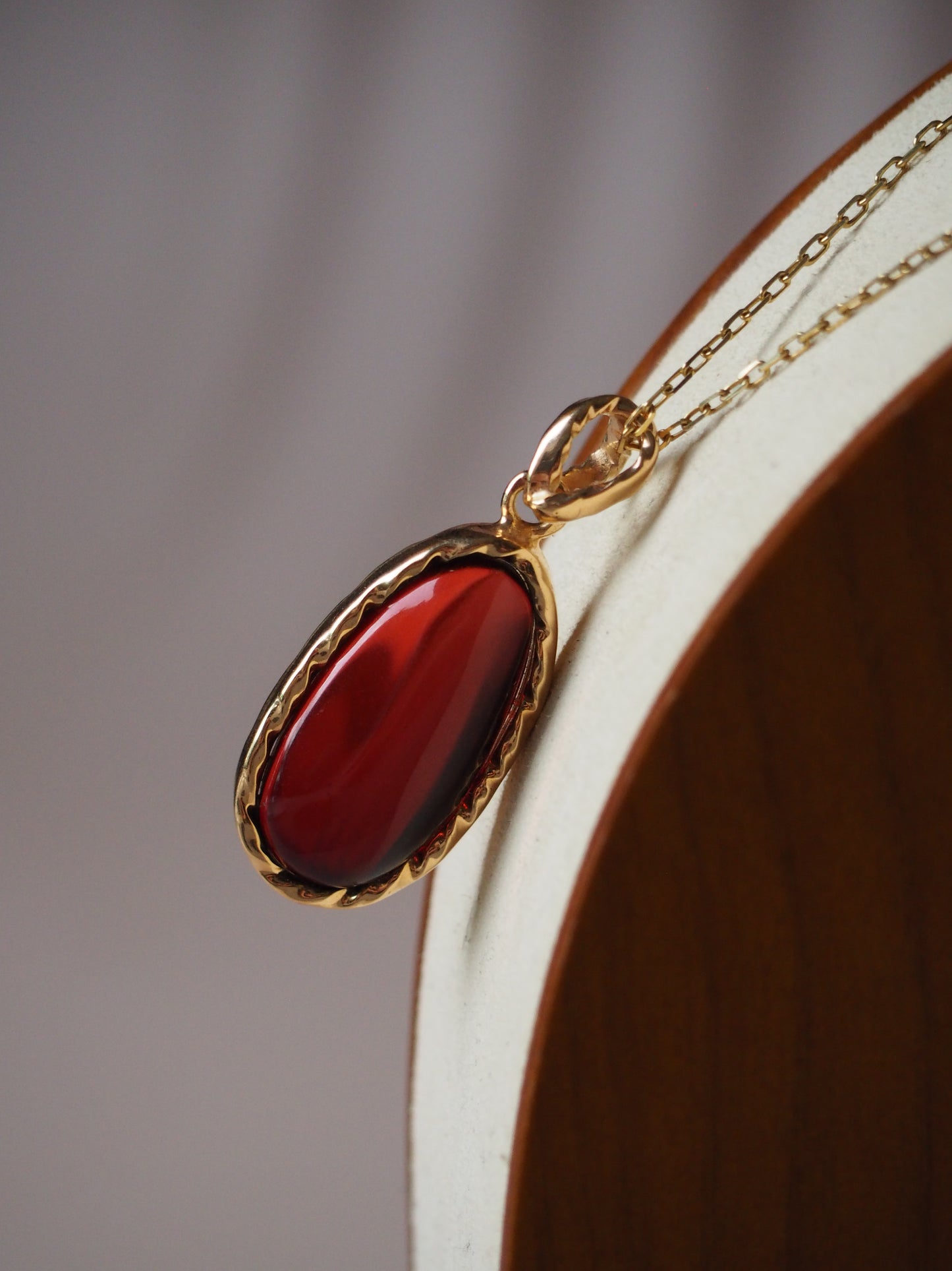 Cherry Amber Oval Pendant in Gold Pleated Silver