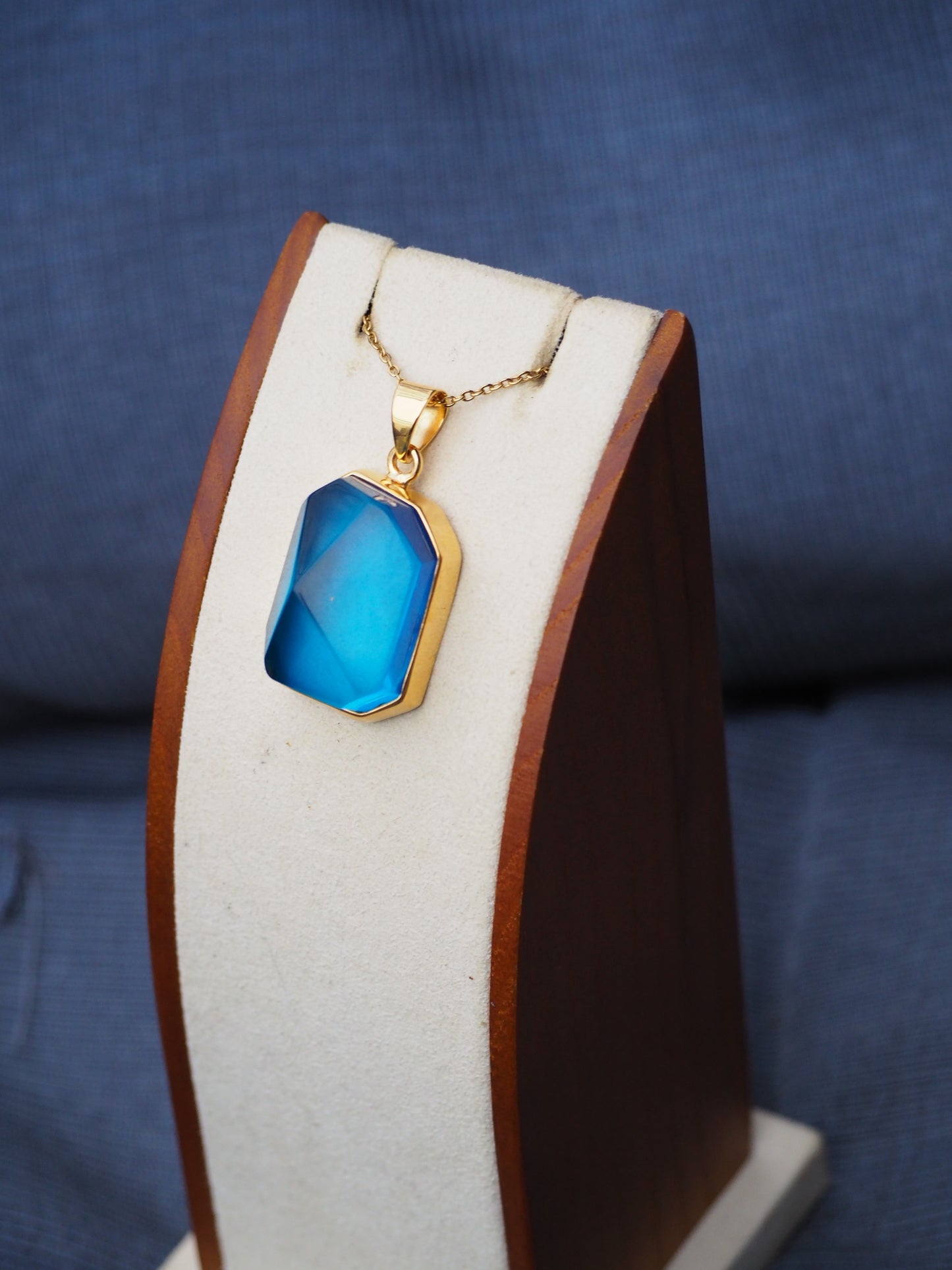 Irregular Polished Blue Amber Pendant in Gold Pleated Silver