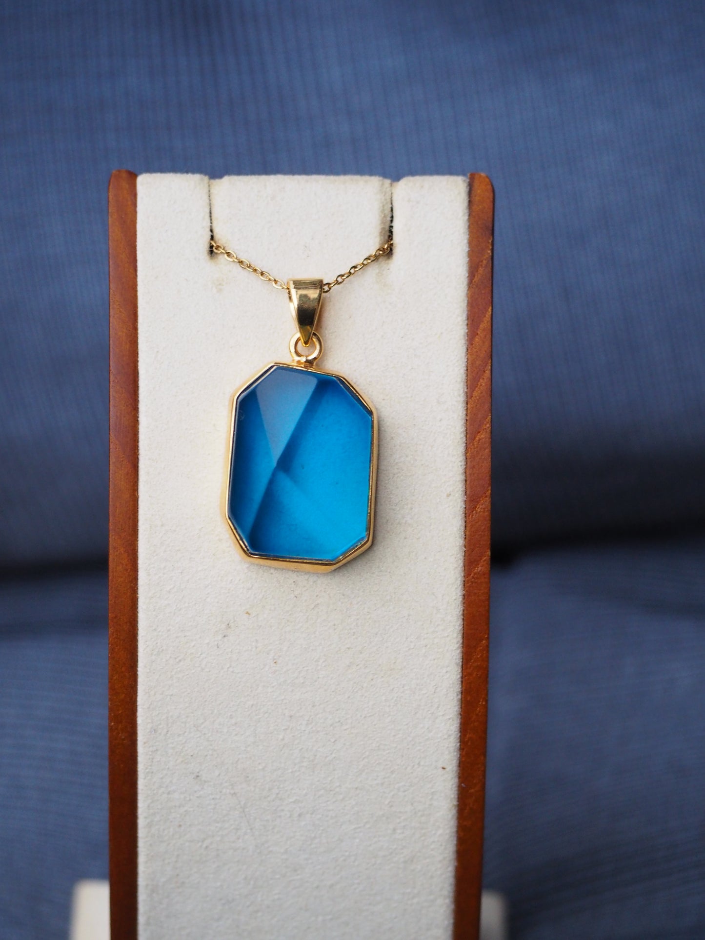 Irregular Polished Blue Amber Pendant in Gold Pleated Silver