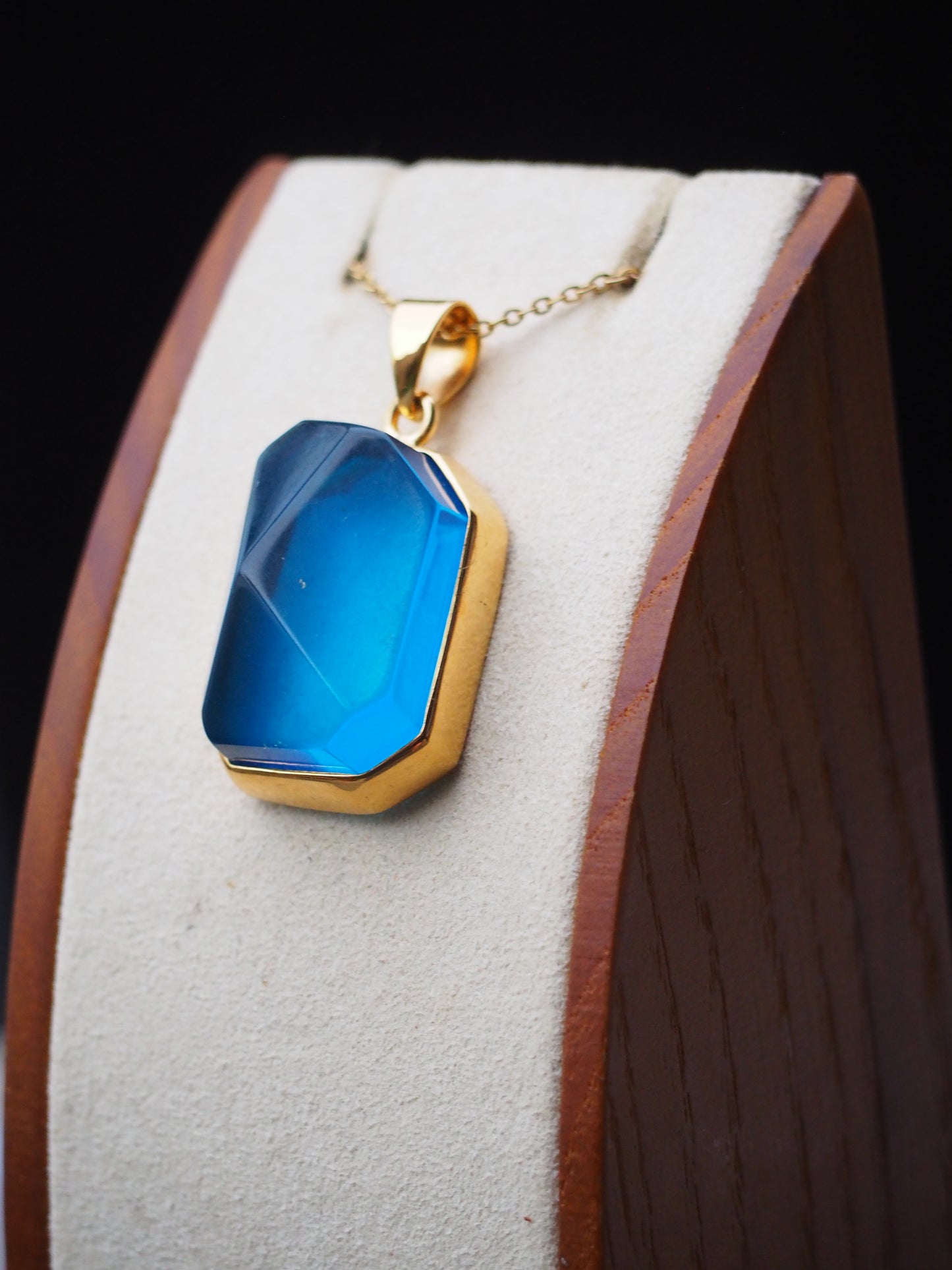Irregular Polished Blue Amber Pendant in Gold Pleated Silver