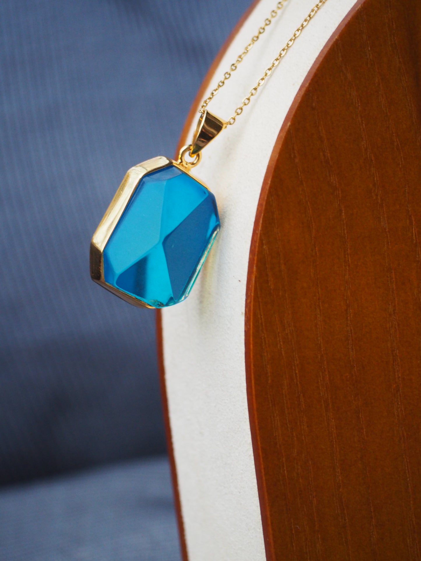 Irregular Polished Blue Amber Pendant in Gold Pleated Silver