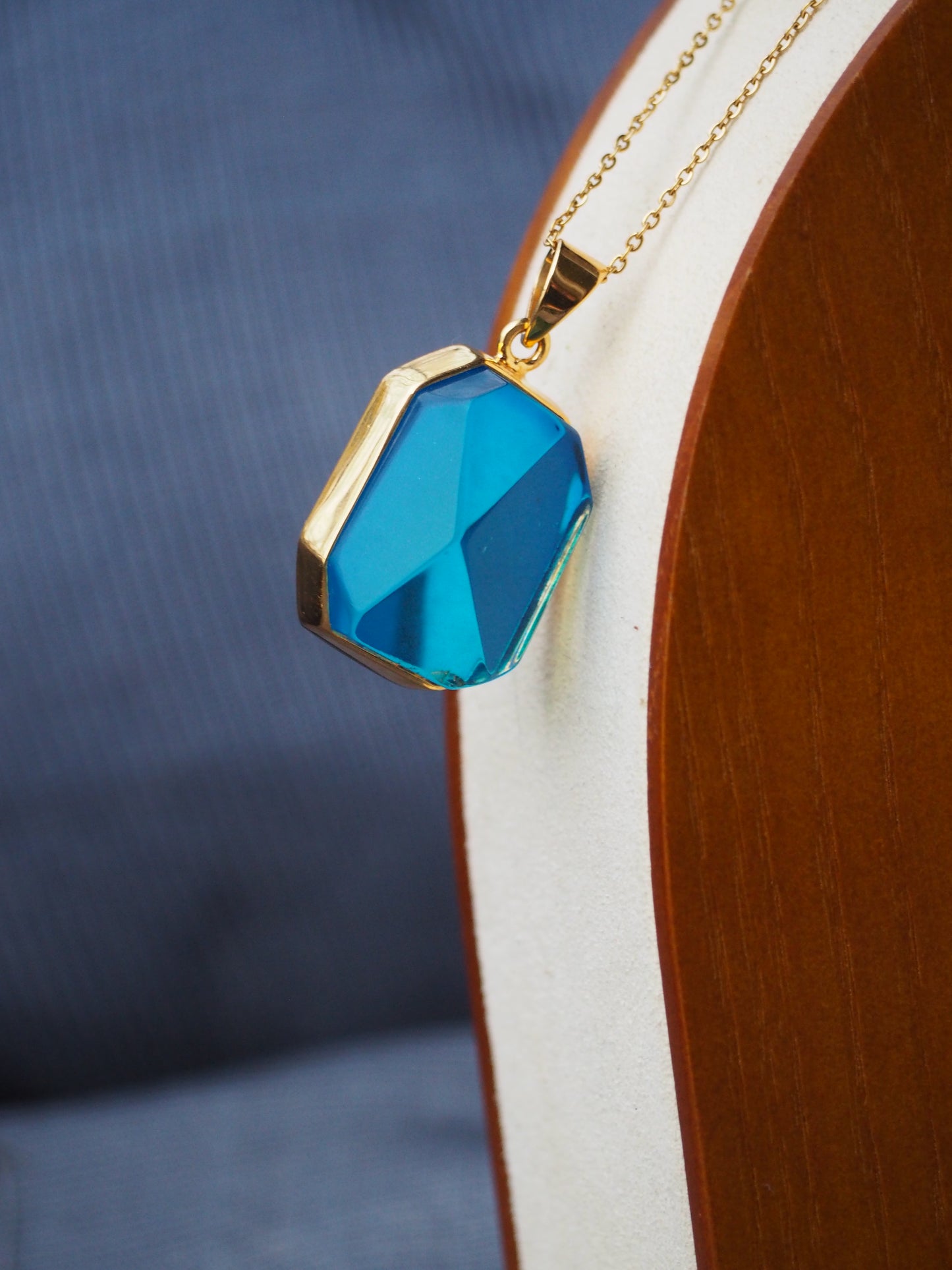 Irregular Polished Blue Amber Pendant in Gold Pleated Silver