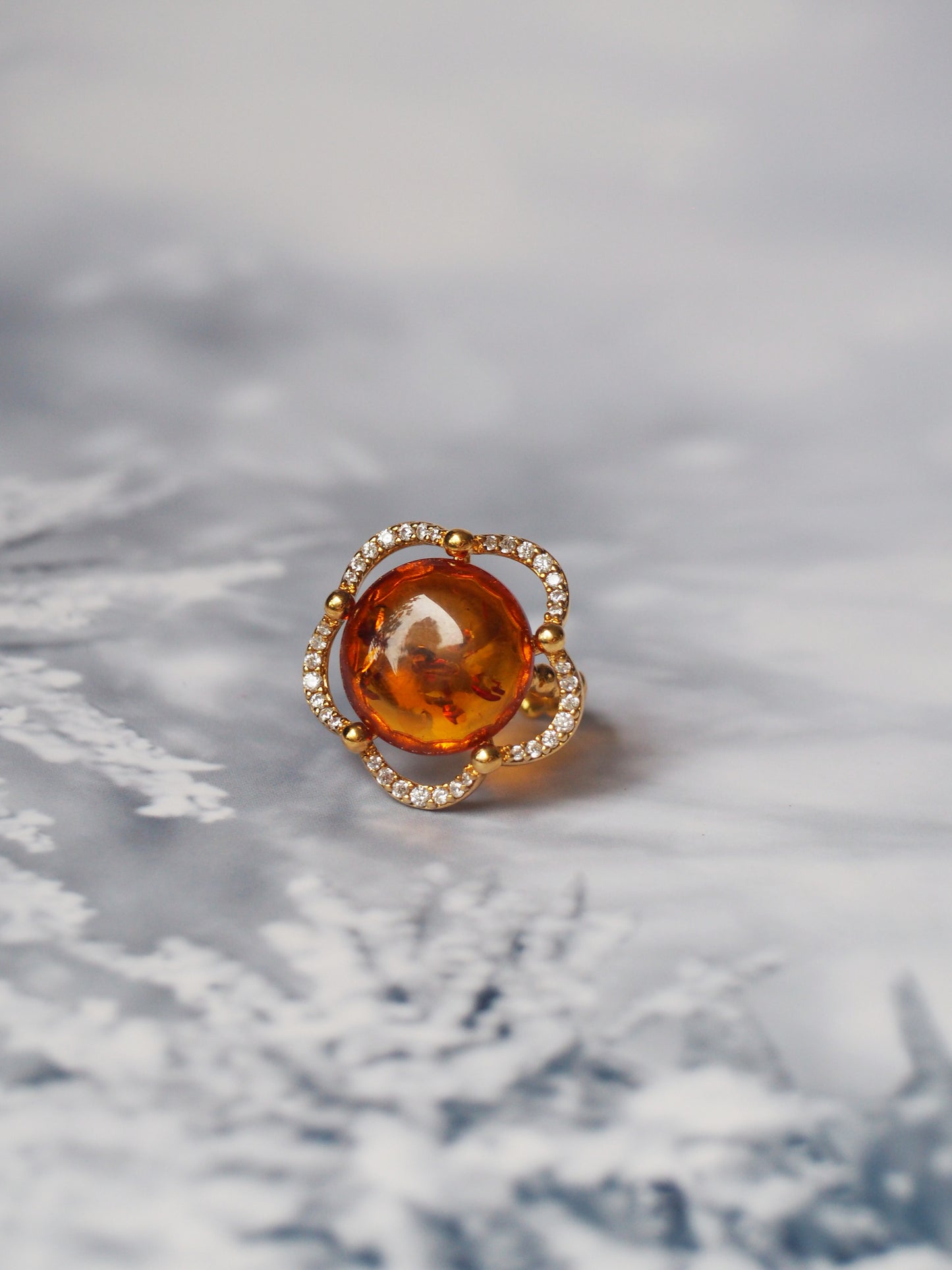 Delicate Flower Shaped Cognac Amber Ring with Cubic Zirconia in Gold Plated Silver