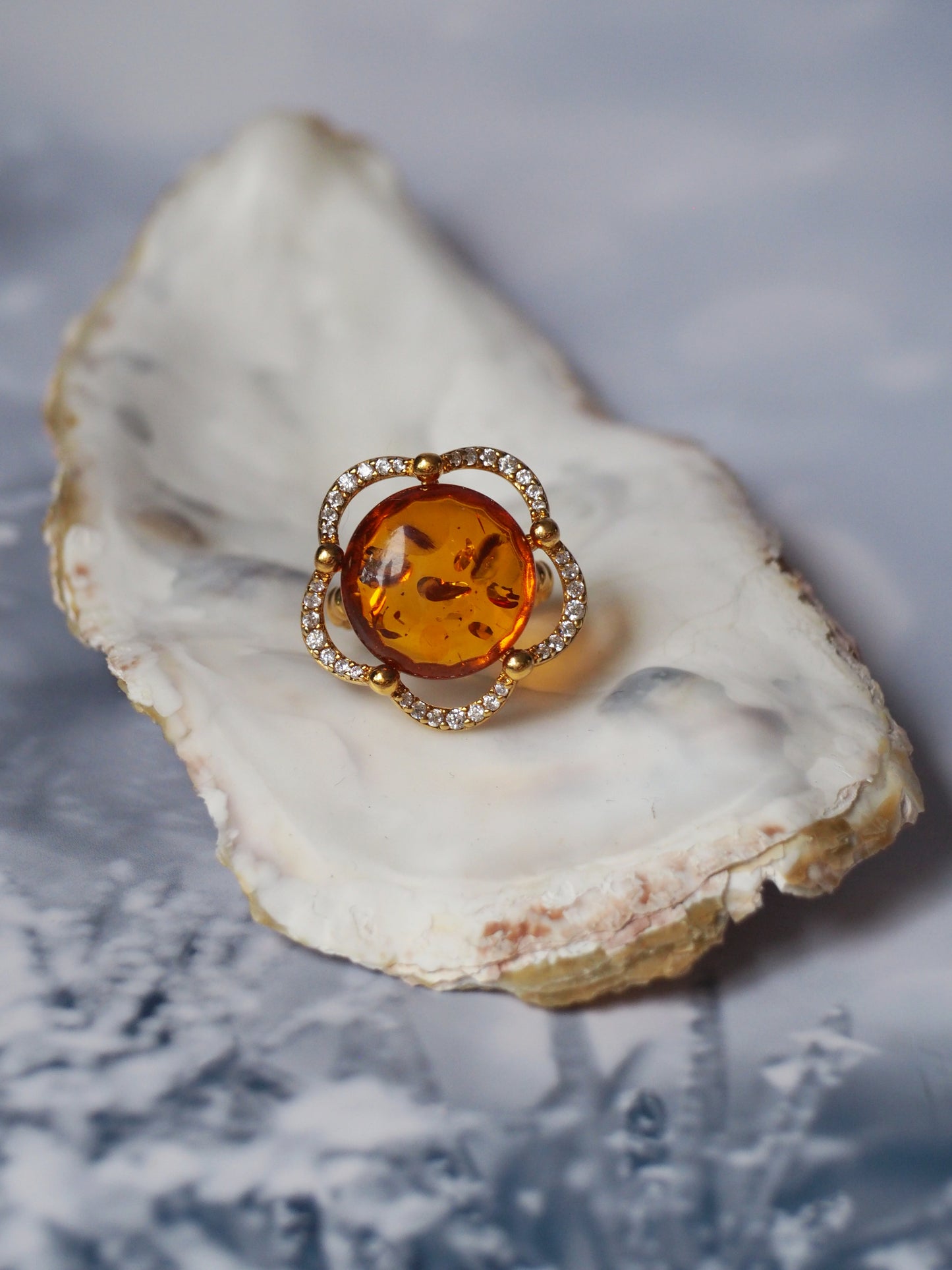 Delicate Flower Shaped Cognac Amber Ring with Cubic Zirconia in Gold Plated Silver