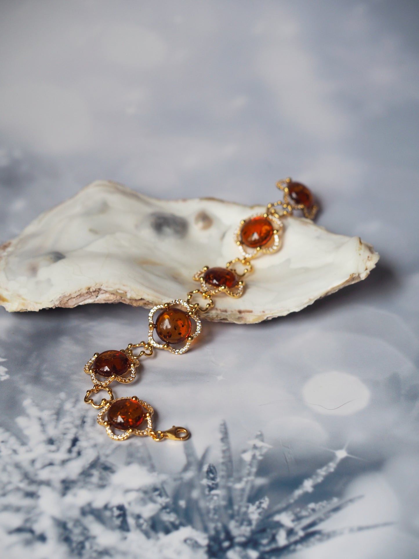 Delicate Flower Shaped Cognac Amber Bracelet with Cubic Zirconia in Gold Plated Silver