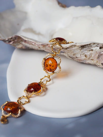 Delicate Flower Shaped Cognac Amber Bracelet with Cubic Zirconia in Gold Plated Silver