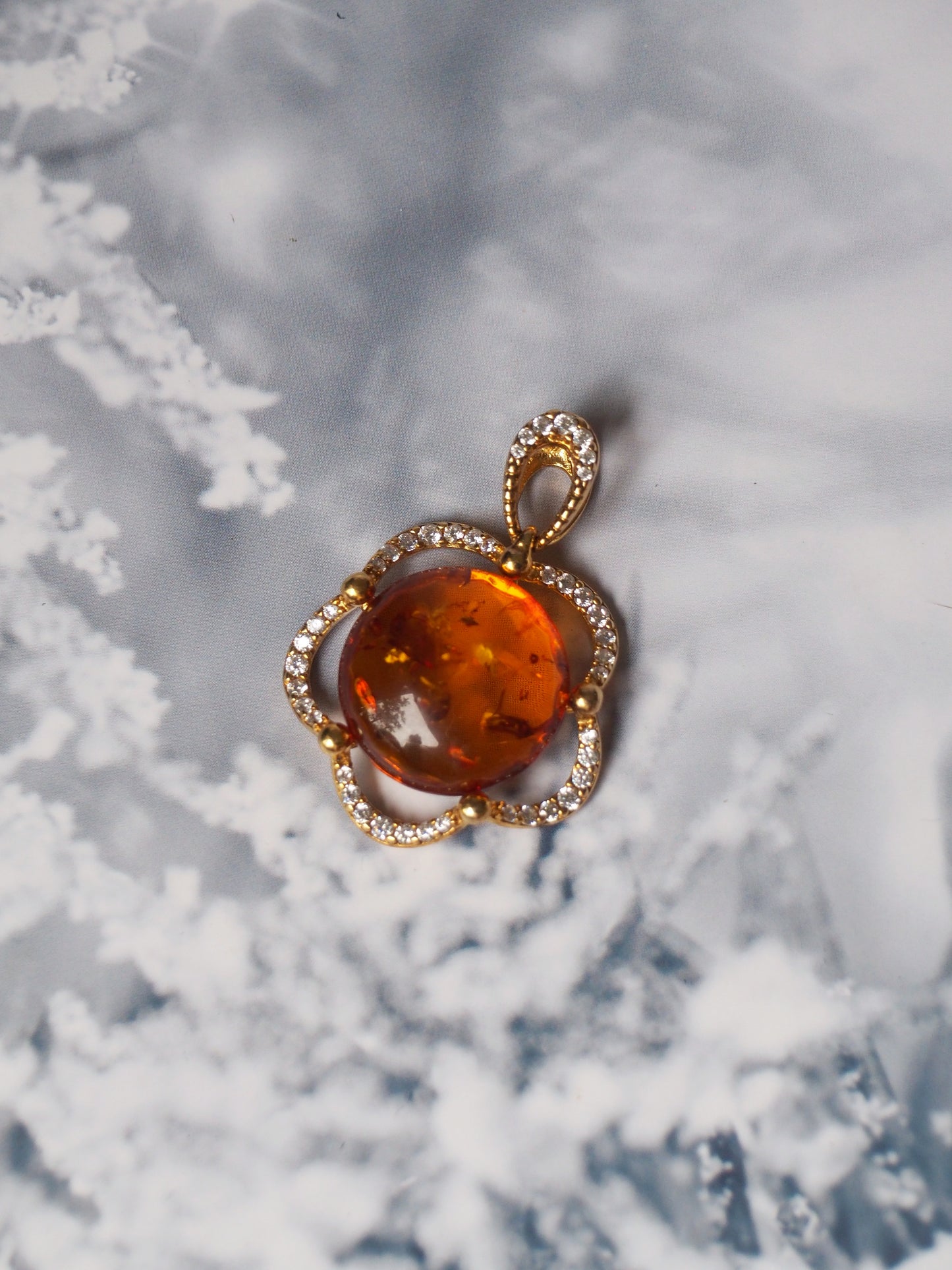 Delicate Flower Shaped Cognac Amber Pendant with Cubic Zirconia in Gold Plated Silver