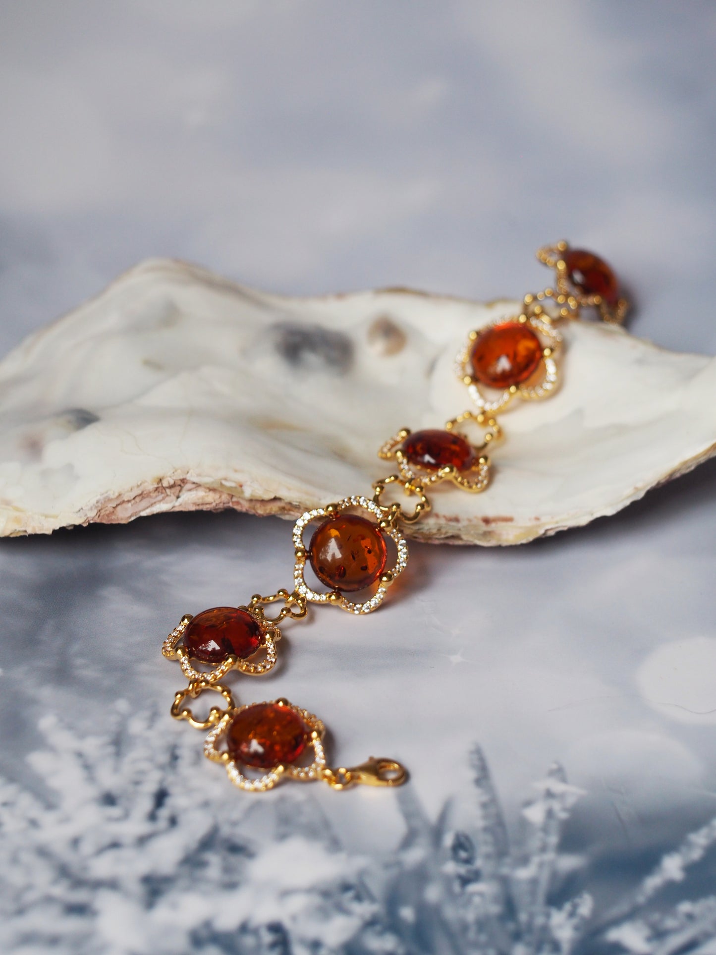 Delicate Flower Shaped Cognac Amber Bracelet with Cubic Zirconia in Gold Plated Silver