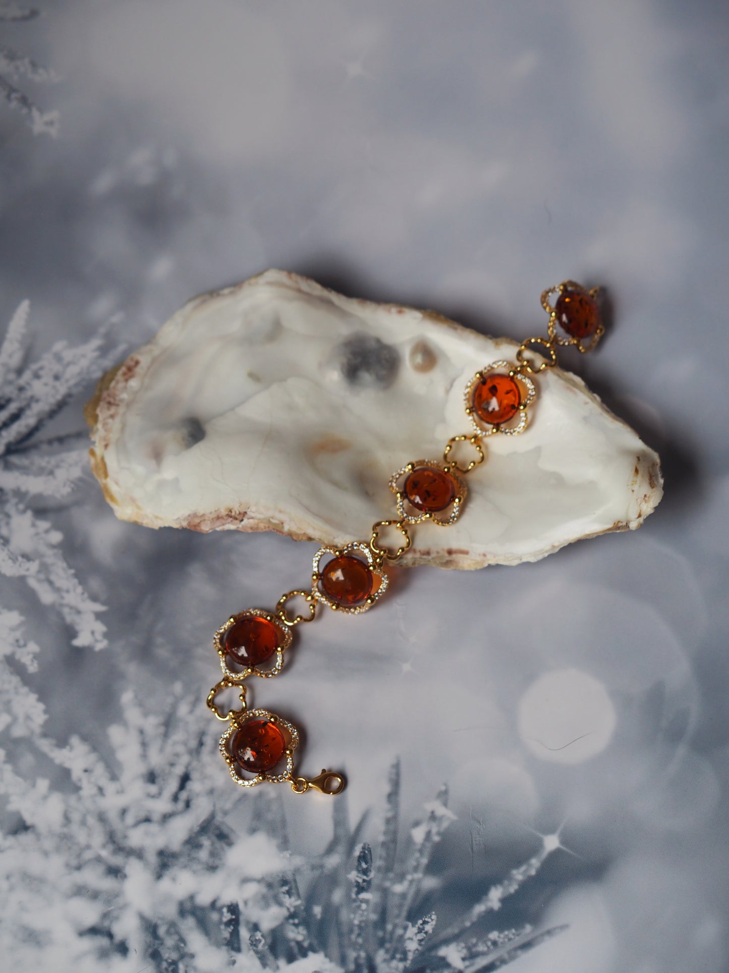 Delicate Flower Shaped Cognac Amber Bracelet with Cubic Zirconia in Gold Plated Silver