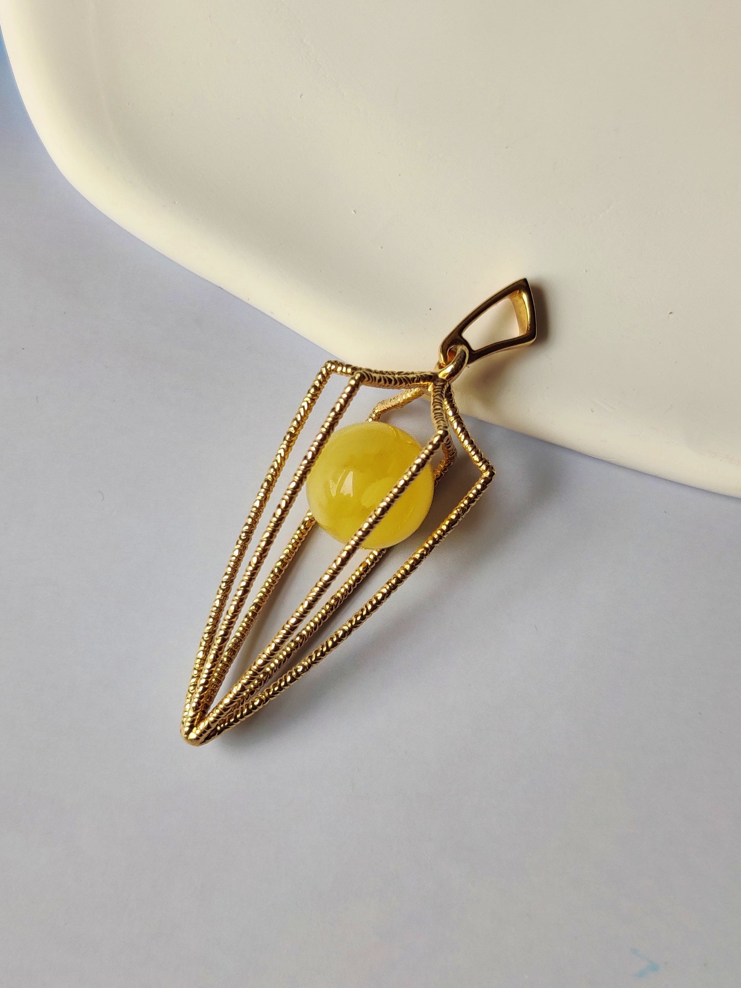 Geometric Cage Pendant With Butterscotch Amber And Gold Plated Silver