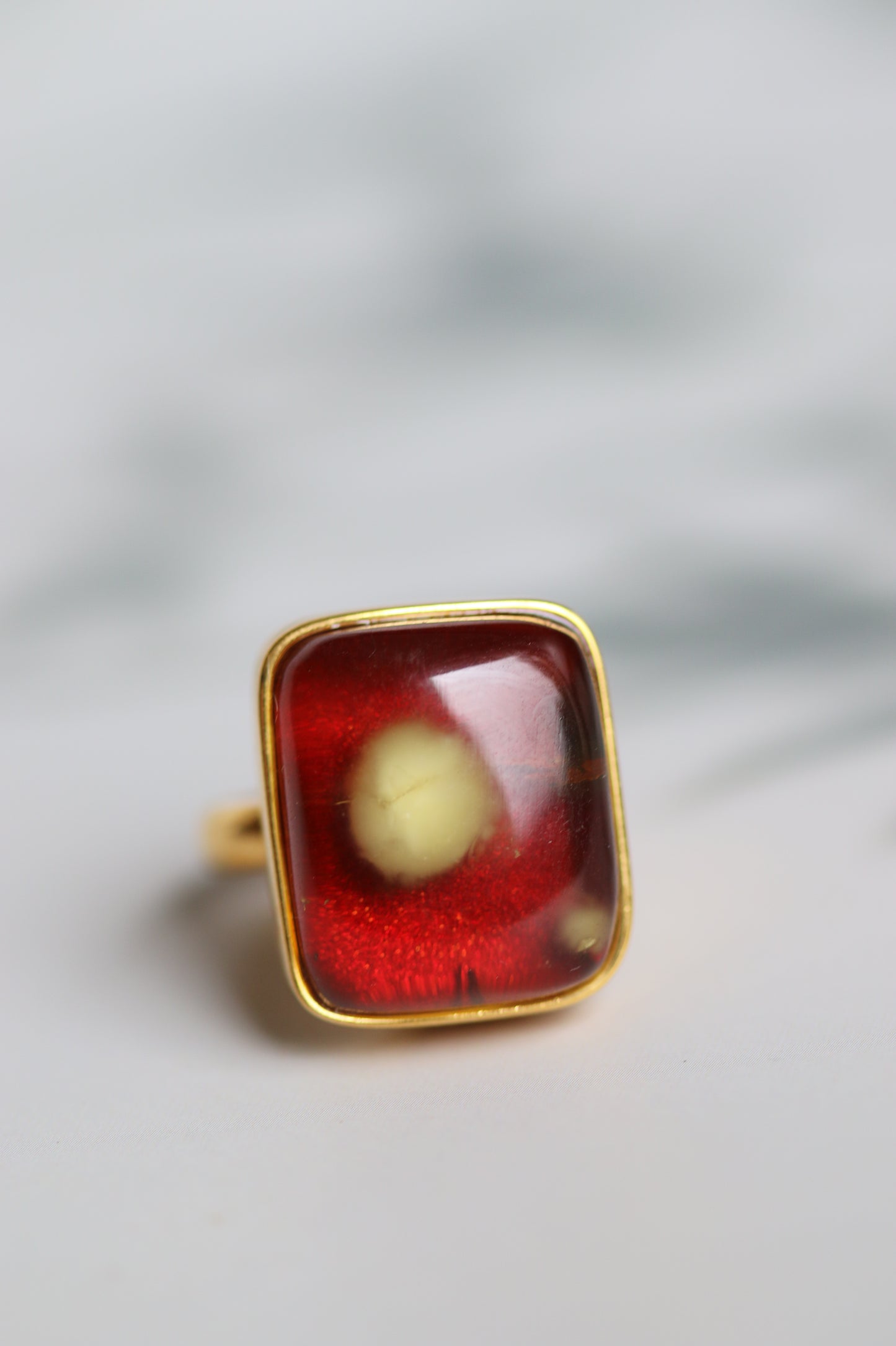 Square Shape Red Amber Ring With Natural Milk Inclusion in Gold Plated Silver Frame