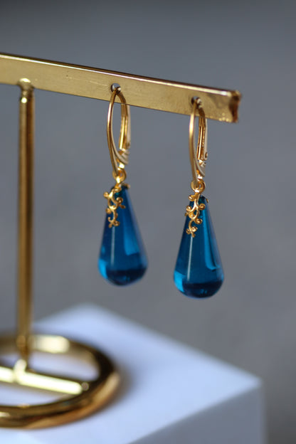 Blue Tear Shaped Amber Earrings in Gold Pleated Silver