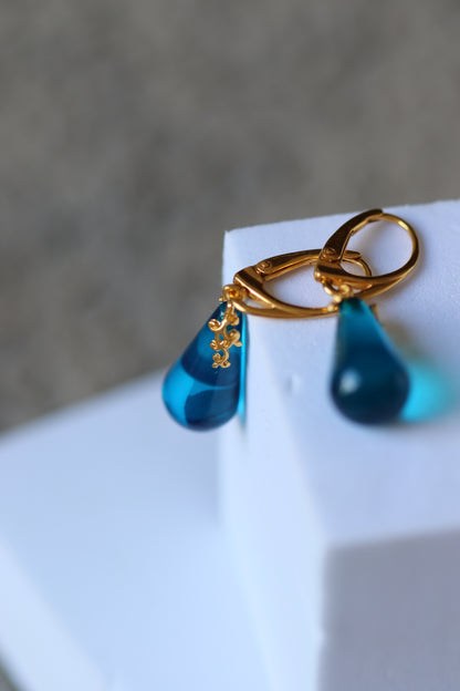 Blue Tear Shaped Amber Earrings in Gold Pleated Silver