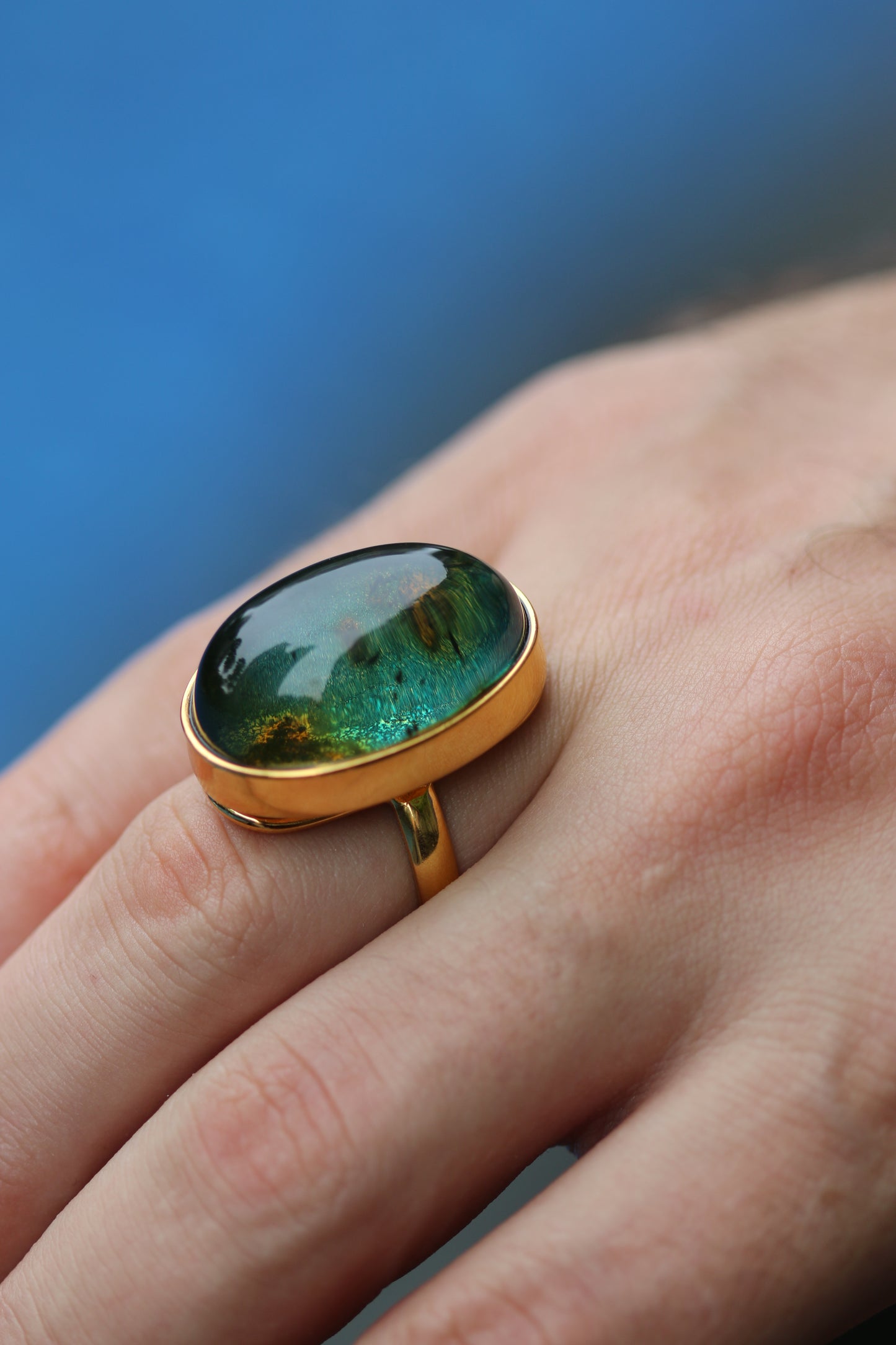 Oval Shape Blue Amber Ring with Natural Inclusions in Gold Plated Silver