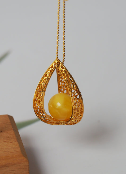 Triangle Butterscotch Amber Pendant with Gold Plated Silver Frame