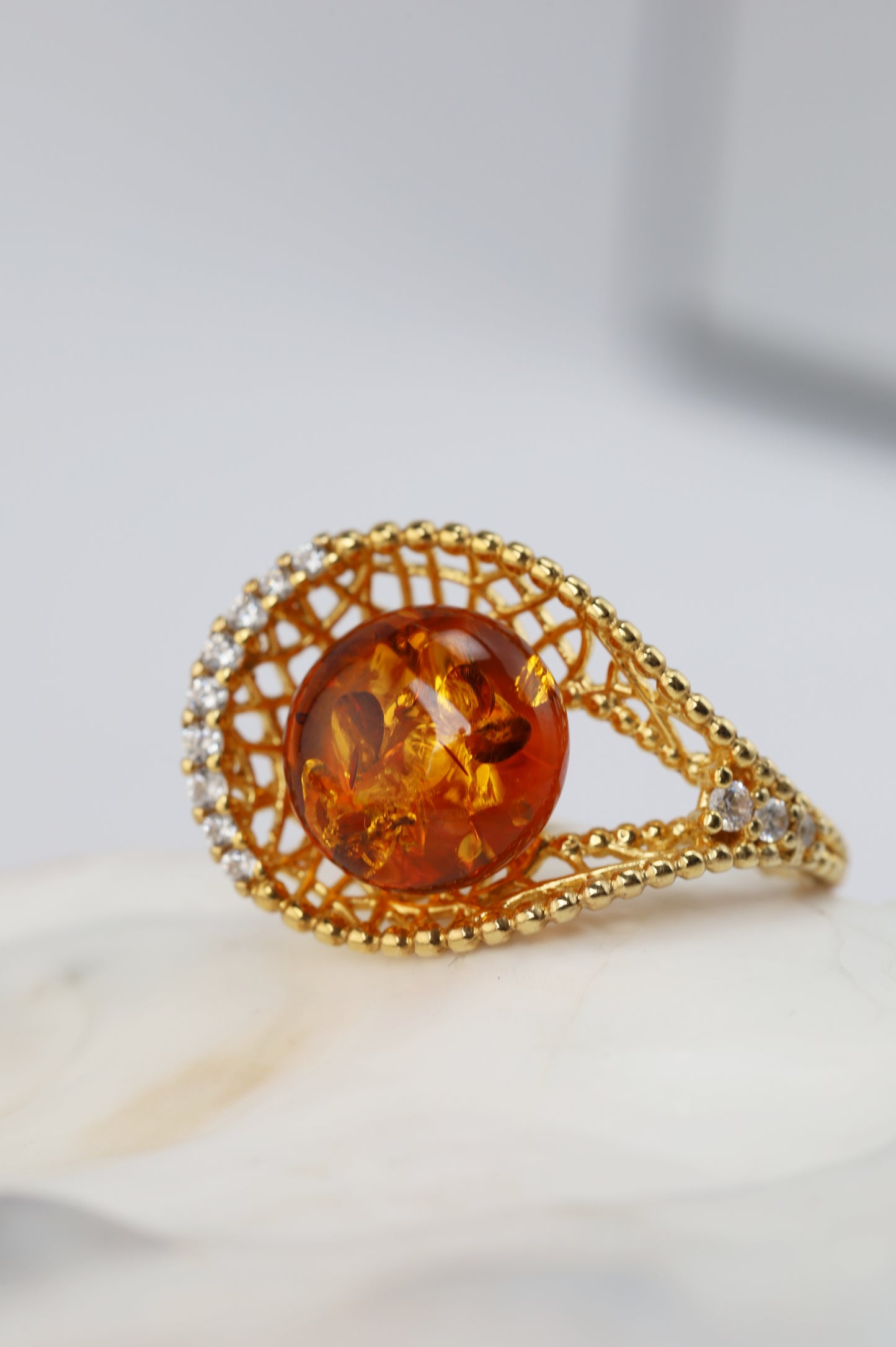 Tear Shaped Cognac Amber Adjustable Ring in Gold Plated Silver with Zirconias