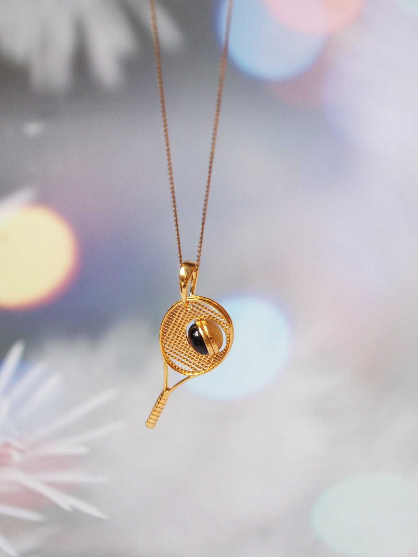 Tennis Racket Pendant with Rotating Double Color Amber