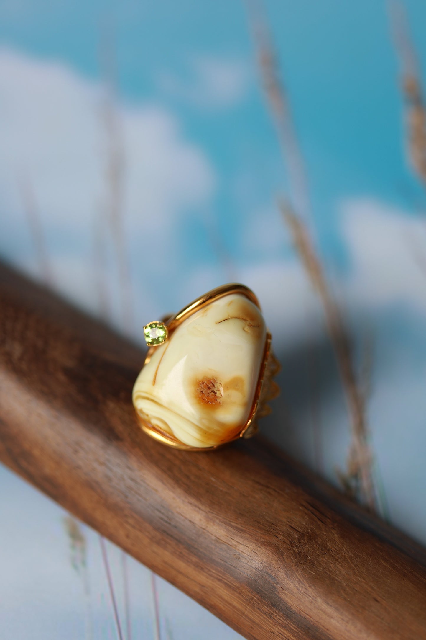 Irregular Royal White Amber Ring With Gold Plated Frame And Green Topaz