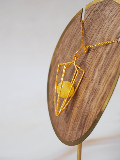 Geometric Cage Pendant With Butterscotch Amber And Gold Plated Silver