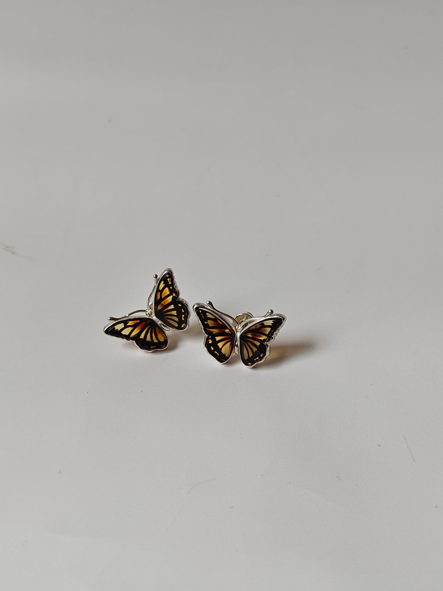 Butterfly Shaped Citron Stud Amber Earrings in Silver Frame