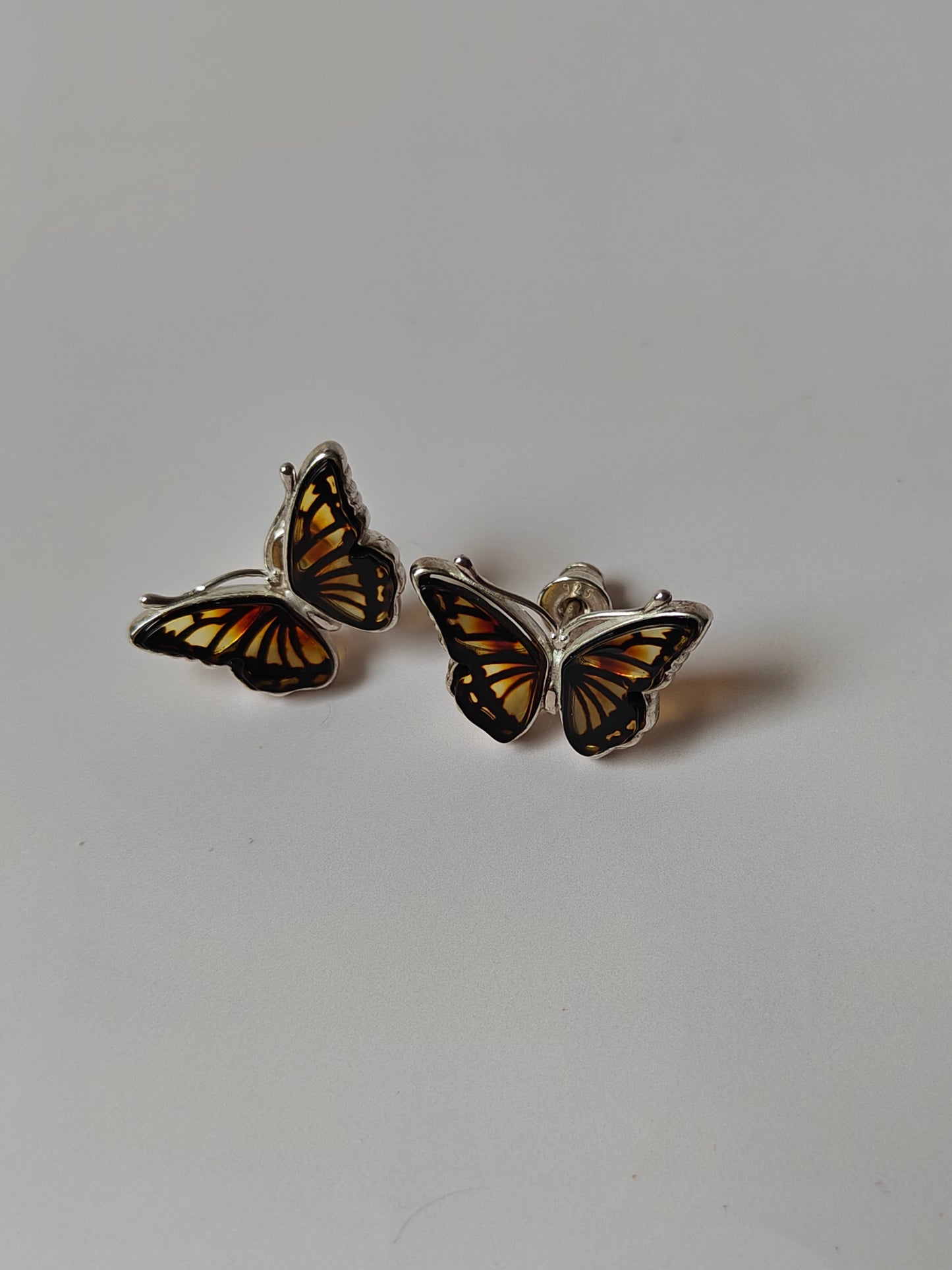 Butterfly Shaped Citron Stud Amber Earrings in Silver Frame