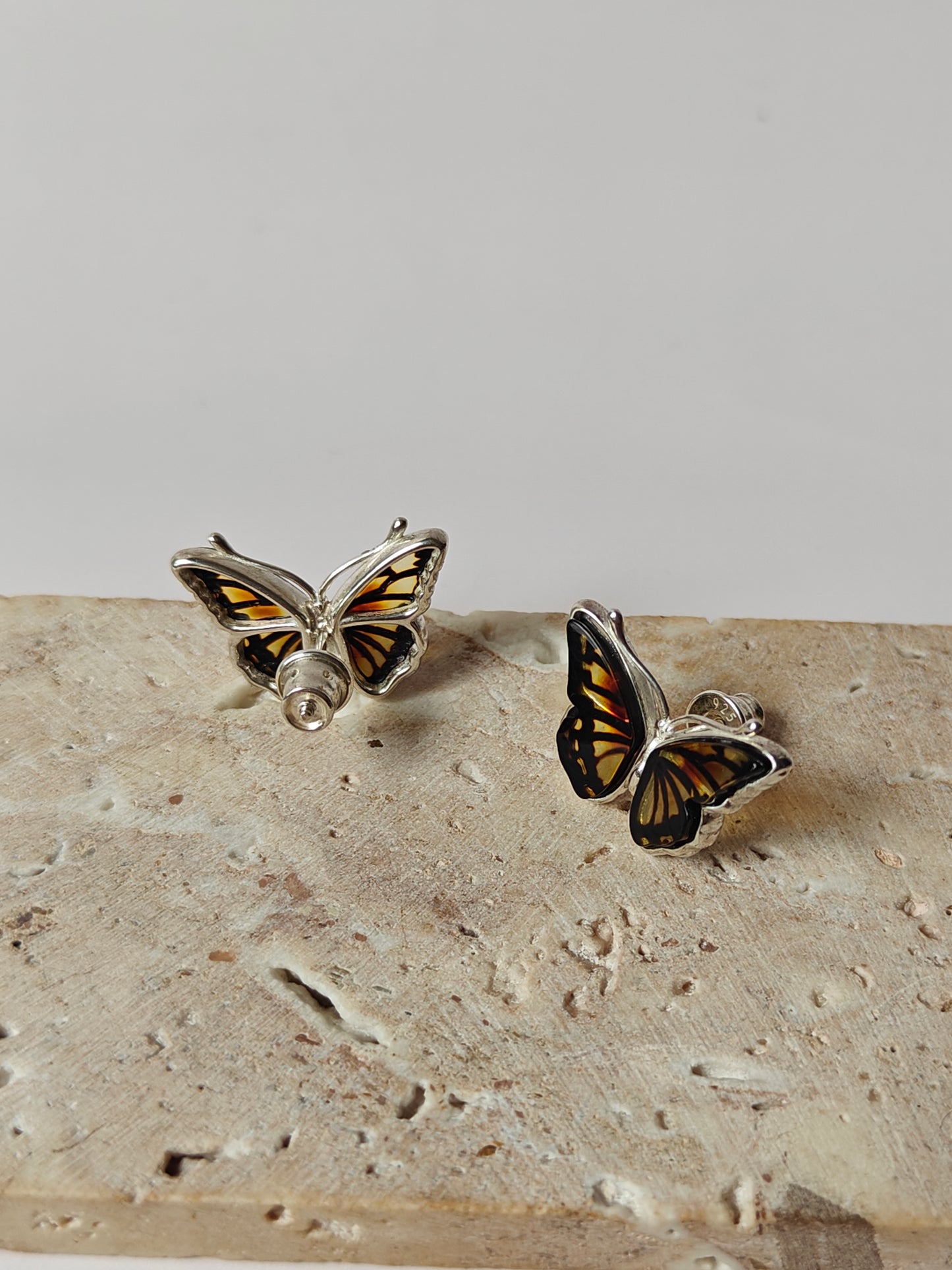 Butterfly Shaped Citron Stud Amber Earrings in Silver Frame